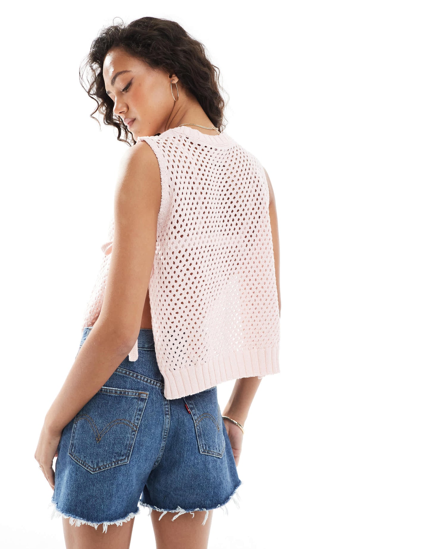 ASOS DESIGN crew neck knit tabard vest with hibiscus flower in pink