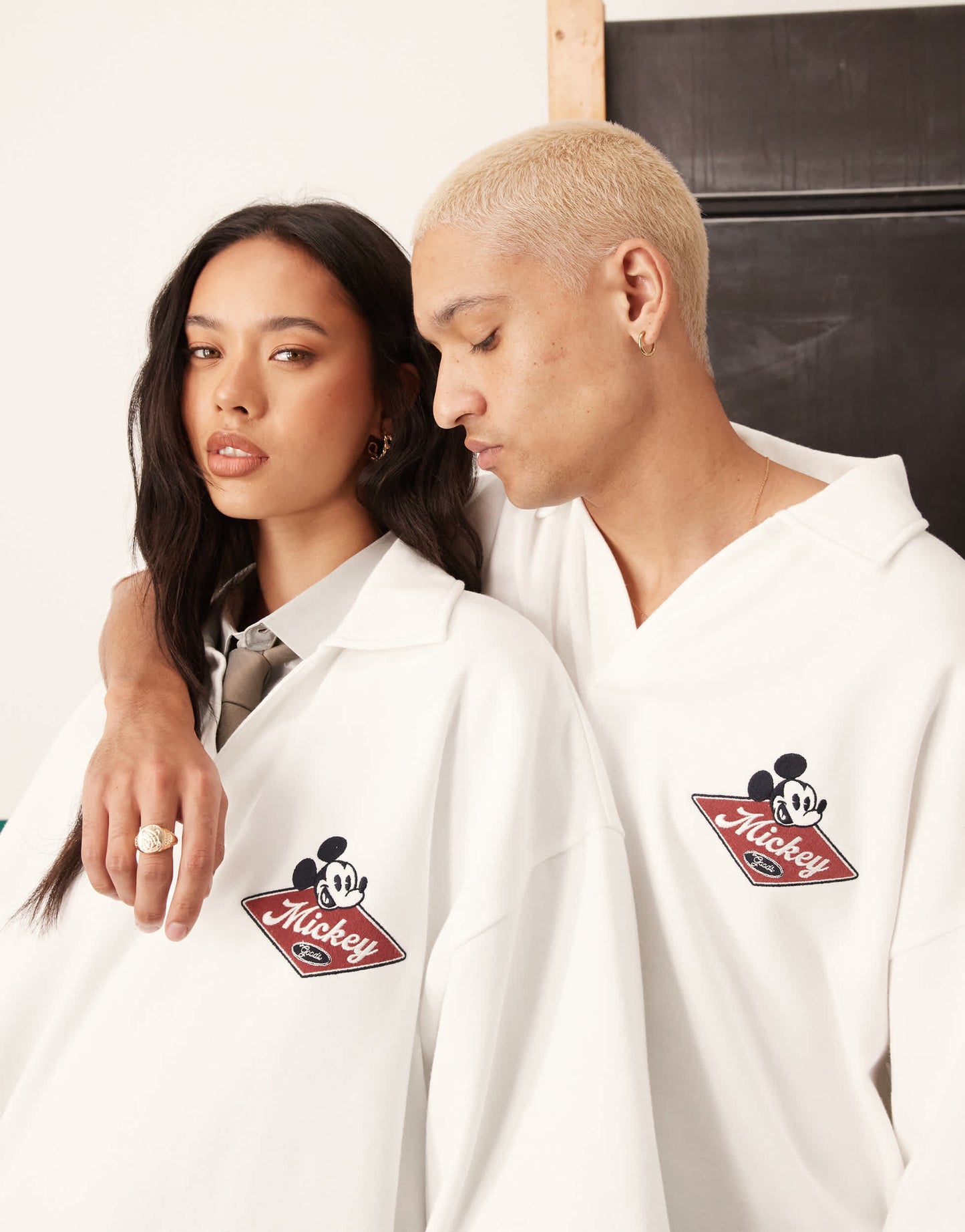 ASOS DESIGN Disney unisex oversized polo with embroidered Mickey Mouse print in off white