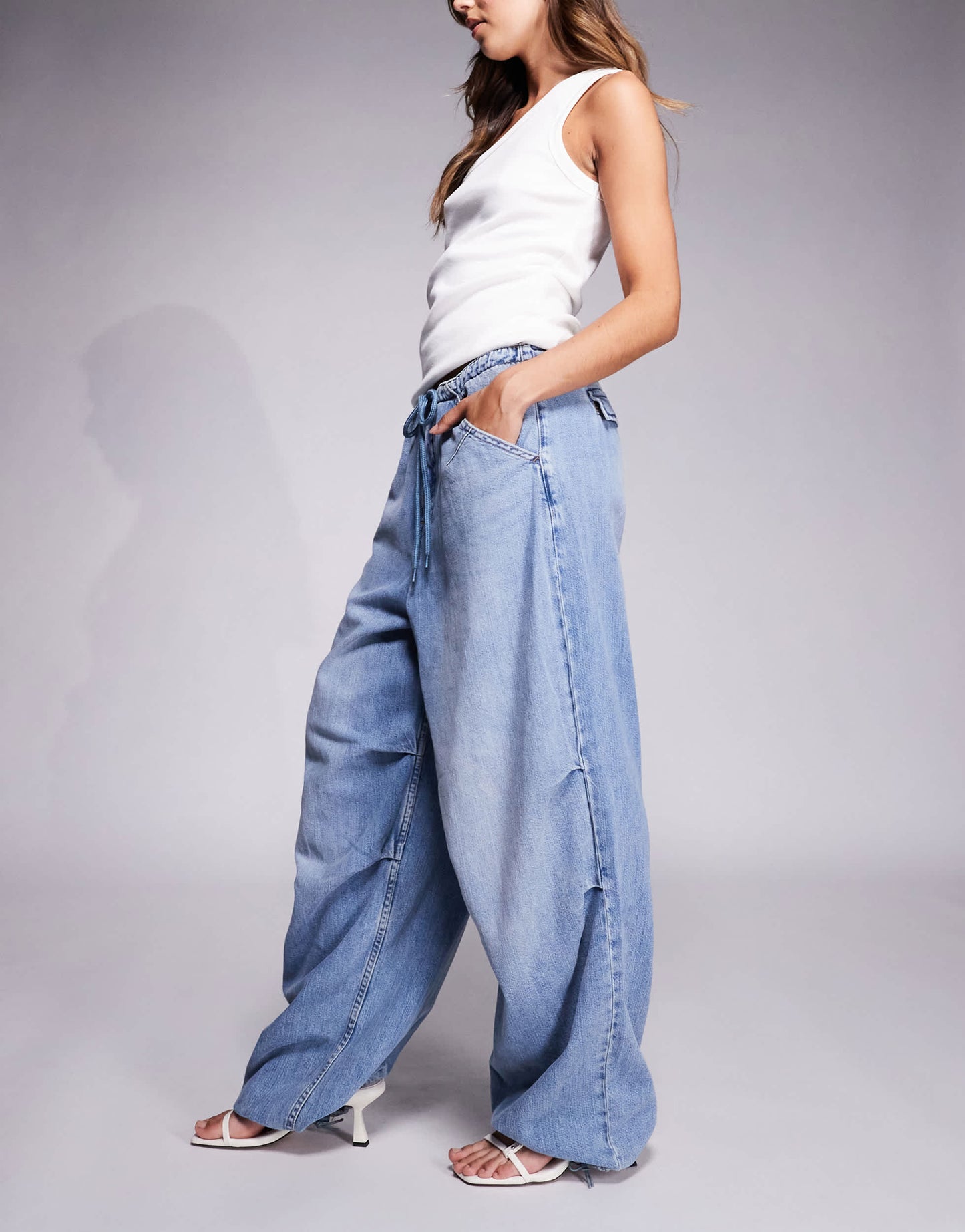 Good American lite linen denim parachute pants in mid blue