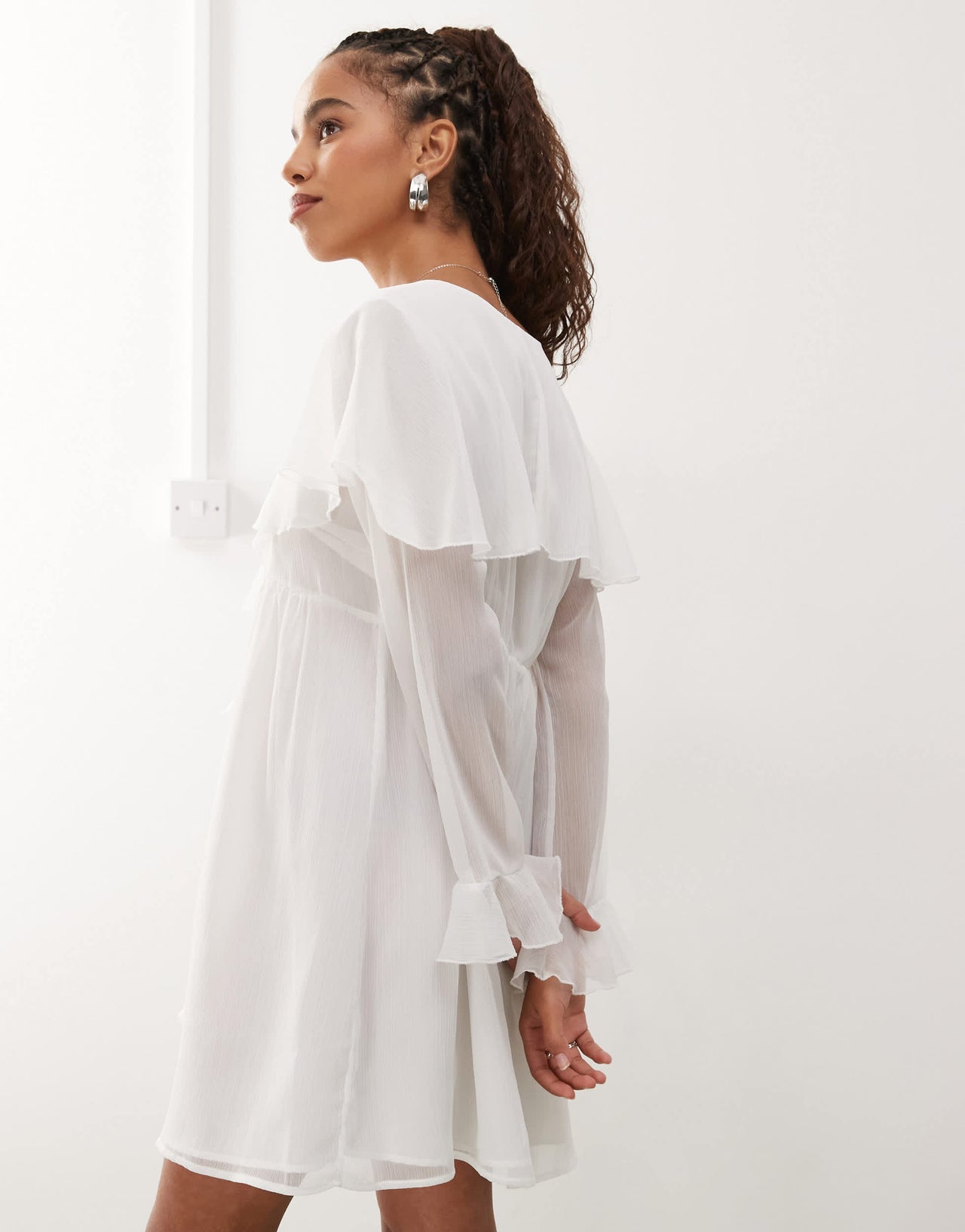 Reclaimed Vintage mini dress with centre front ruffle in white