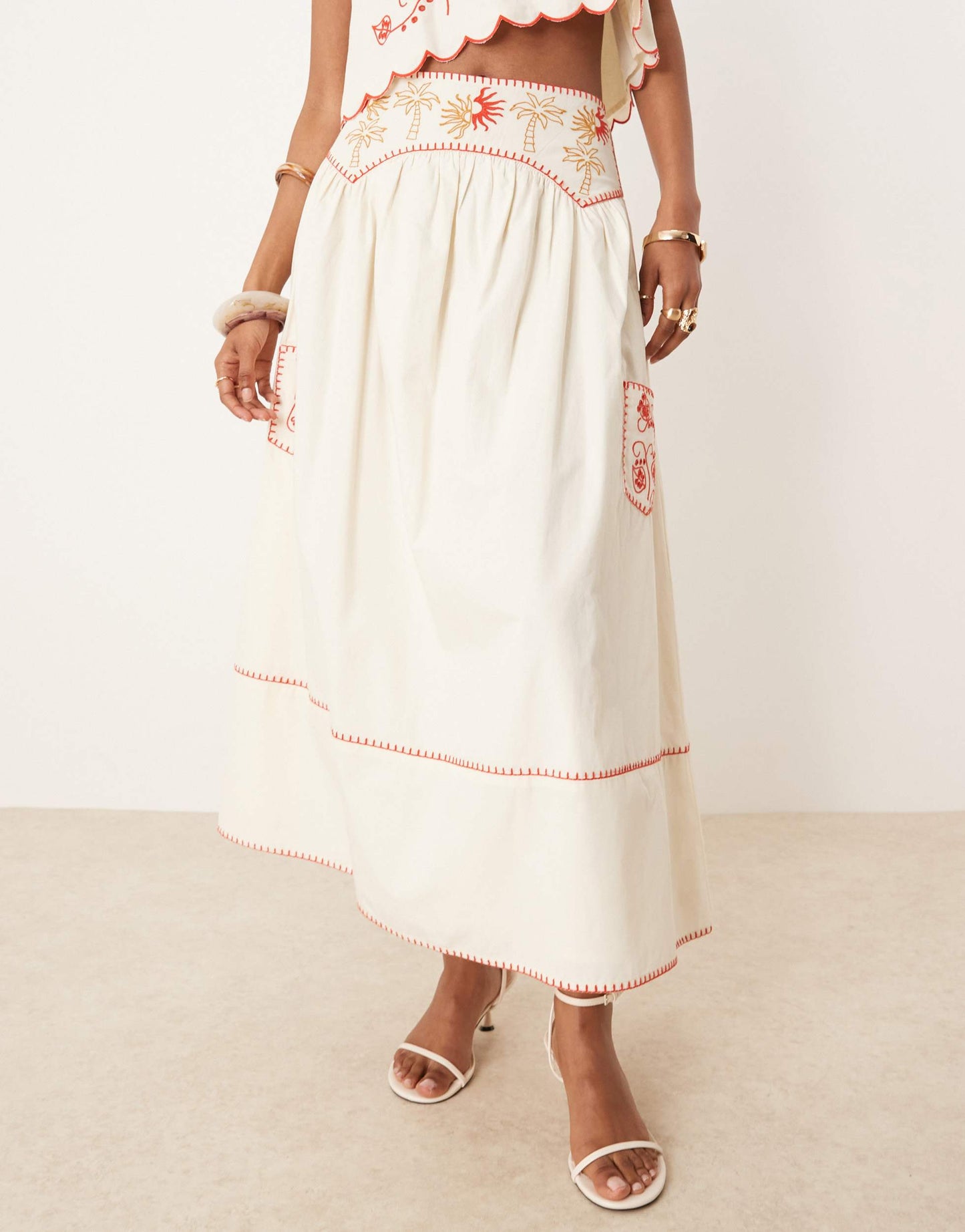 Never Fully Dressed embroidered cotton midaxi skirt co-ord in cream and red