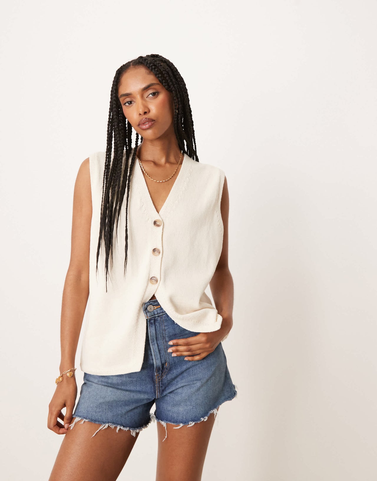 ASOS DESIGN clean knitted relaxed fit waistcoat in cream