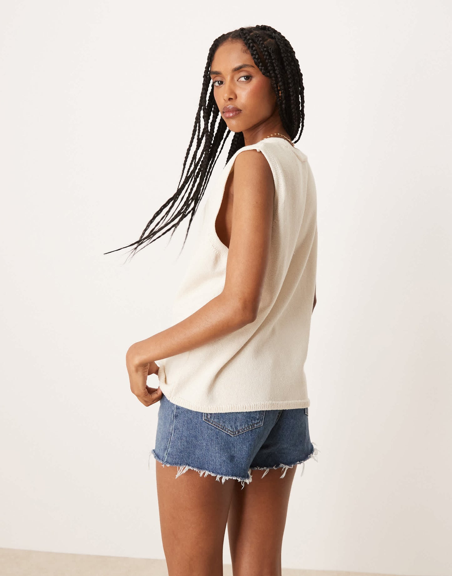 ASOS DESIGN clean knitted relaxed fit waistcoat in cream