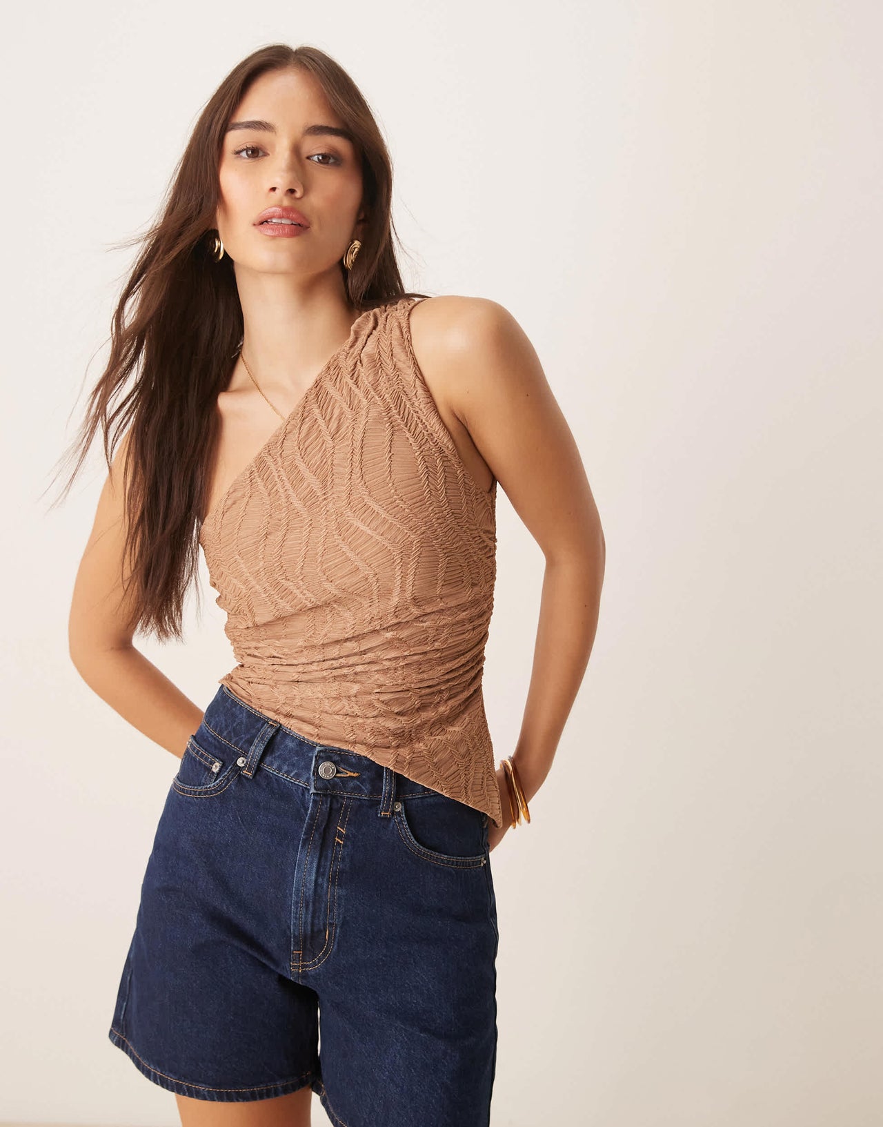ASOS DESIGN textured one shoulder top with asymmetric hem and ruching detail in stone