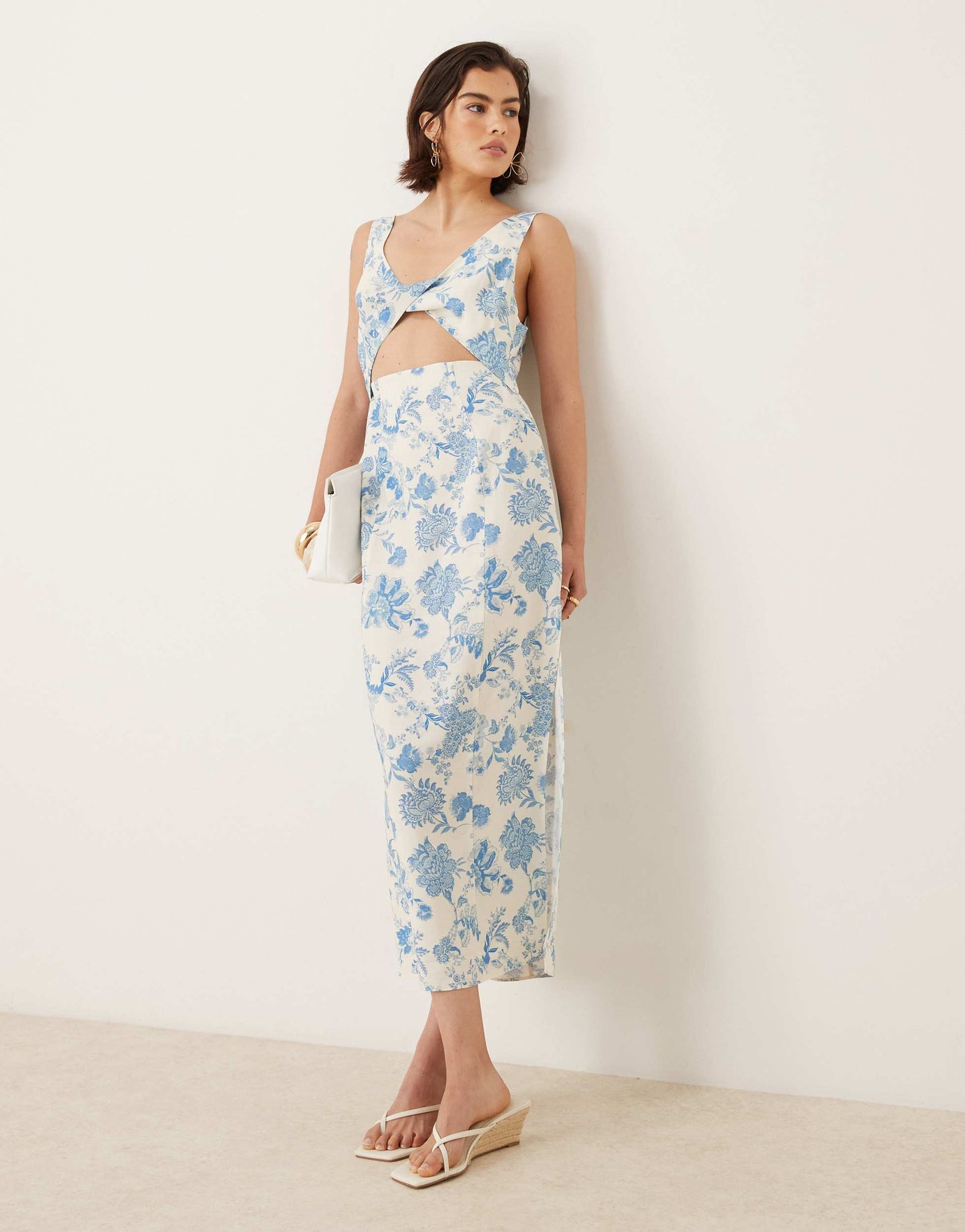 ASOS DESIGN strappy twist bust detail cut out midi dress in floral print