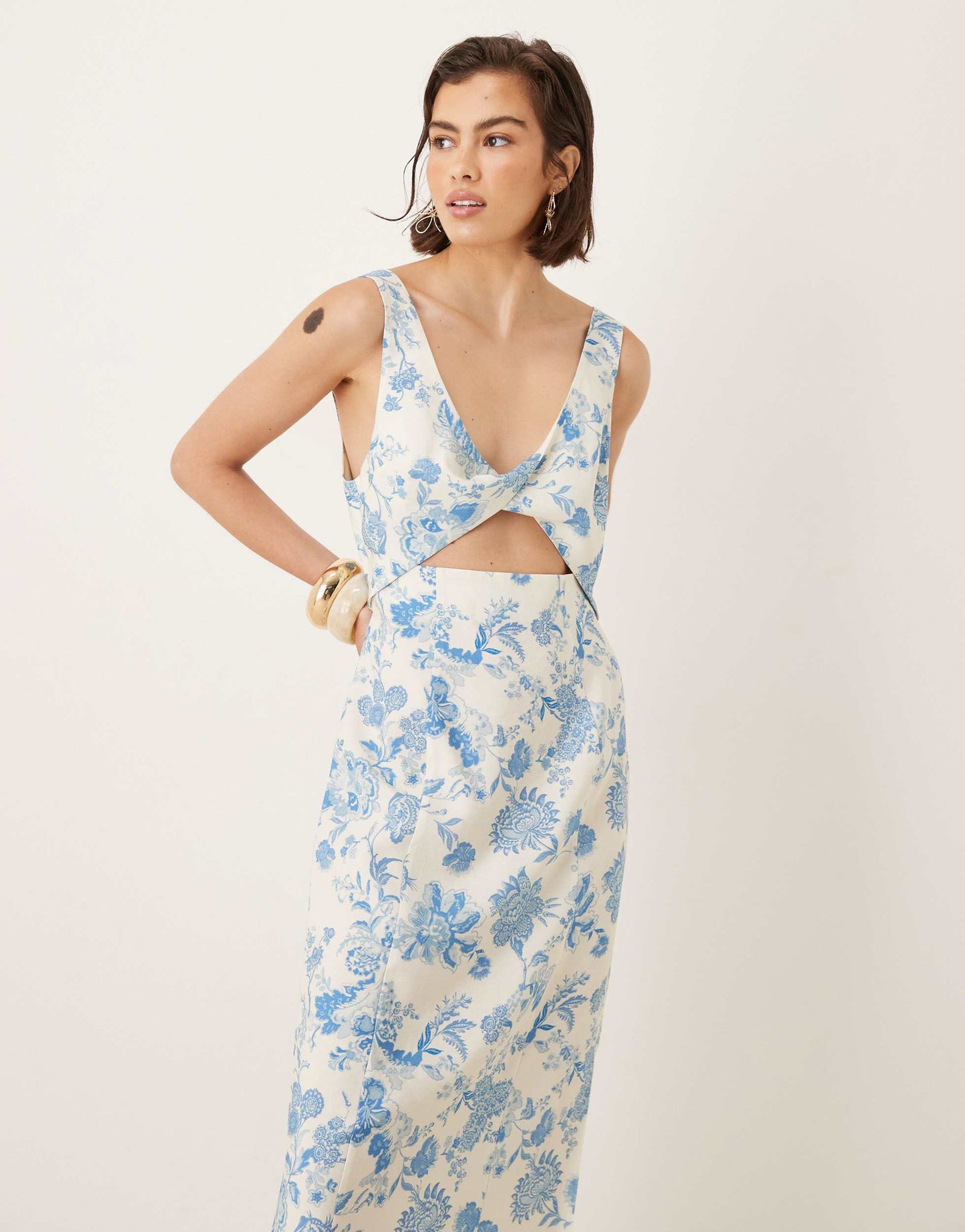 ASOS DESIGN strappy twist bust detail cut out midi dress in floral print