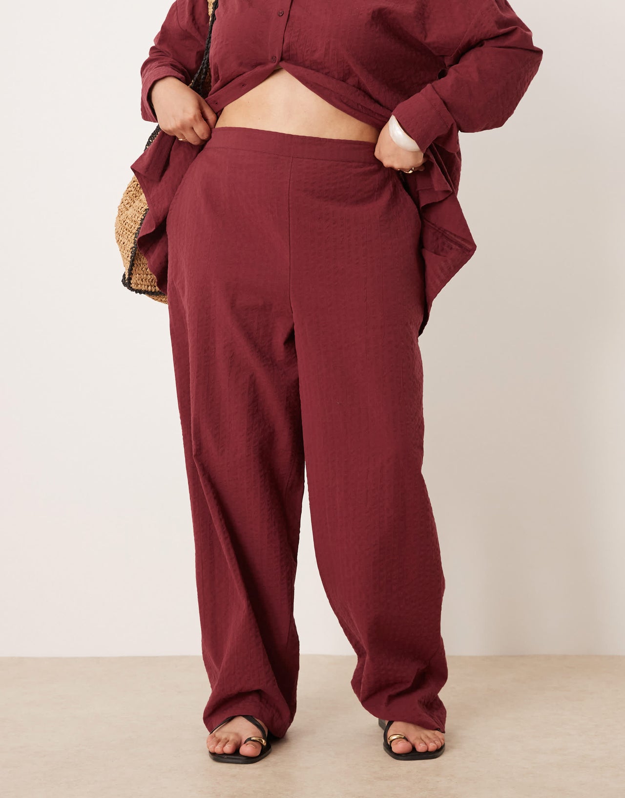 ASOS DESIGN Curve seersucker relaxed pull on trousers co-ord in burgundy