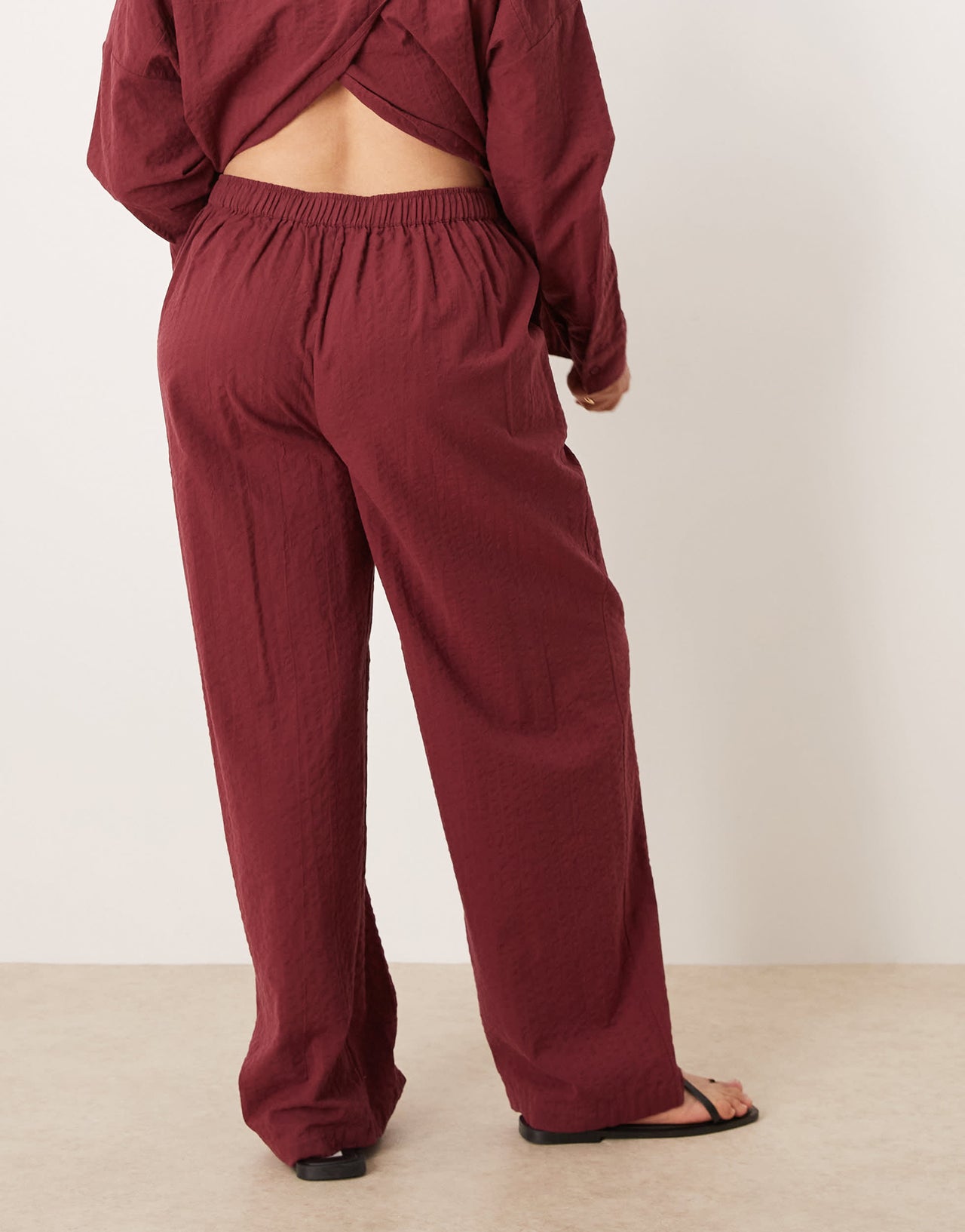 ASOS DESIGN Curve seersucker relaxed pull on trousers co-ord in burgundy