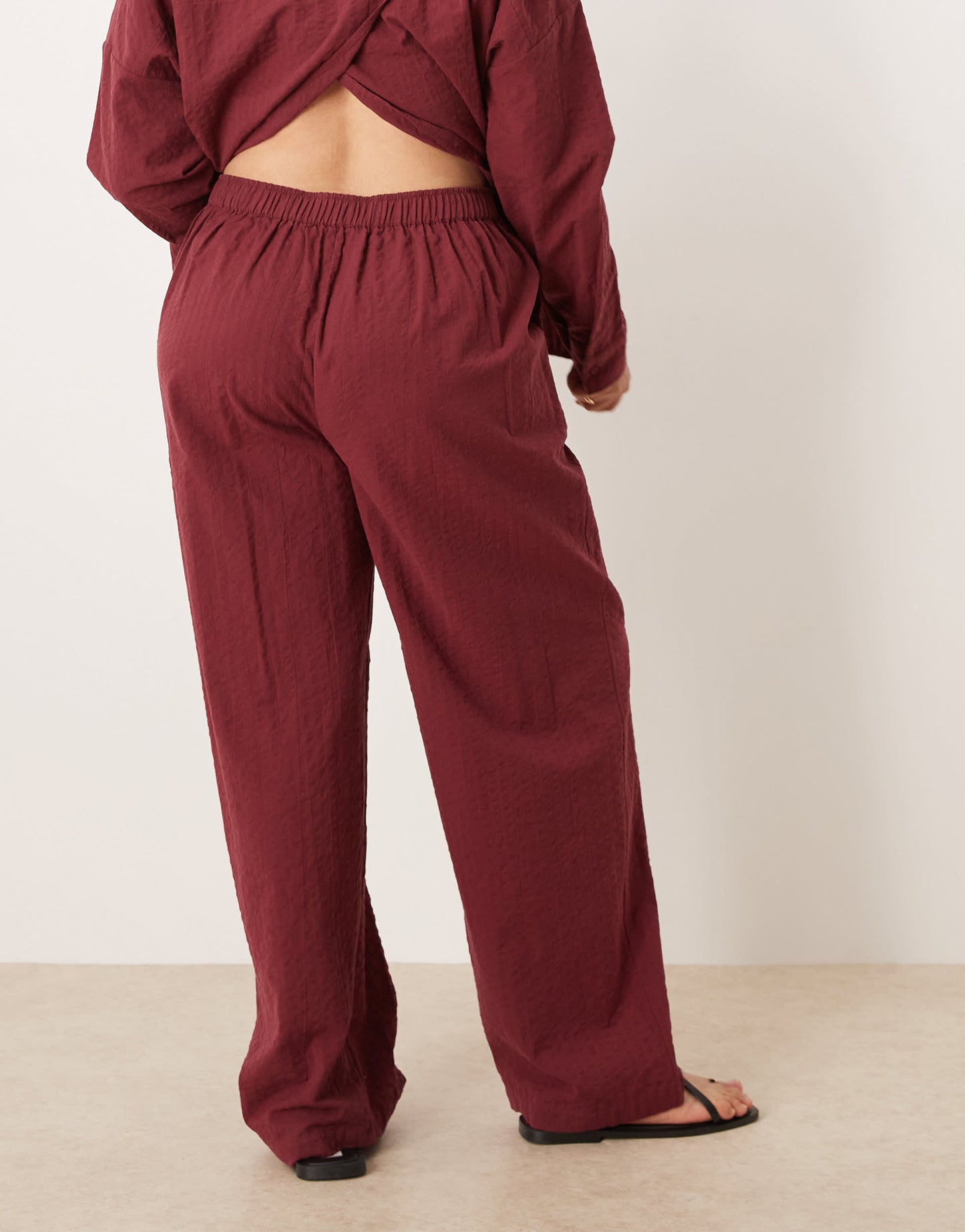 ASOS DESIGN Curve seersucker relaxed pull on trousers co-ord in burgundy