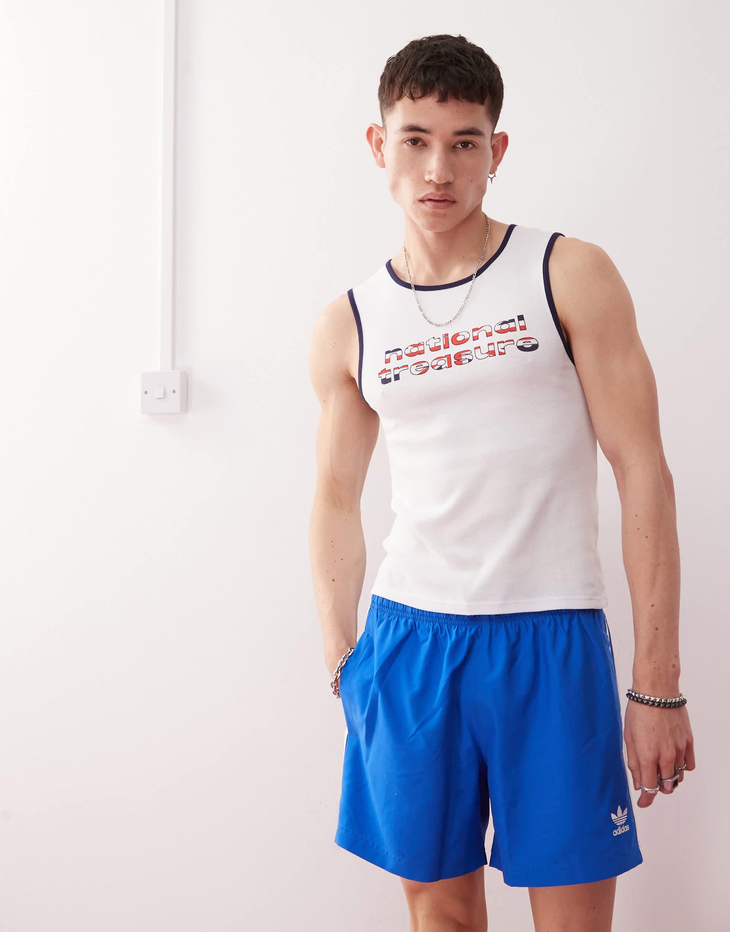 COLLUSION Festival slim vest in white with national treasure slogan