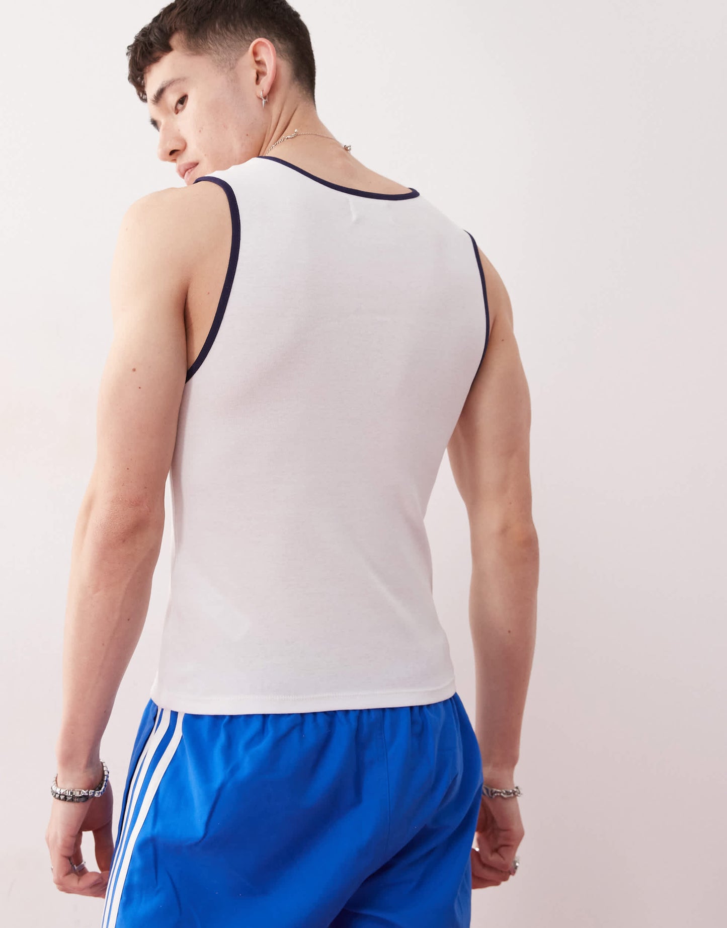 COLLUSION Festival slim vest in white with national treasure slogan