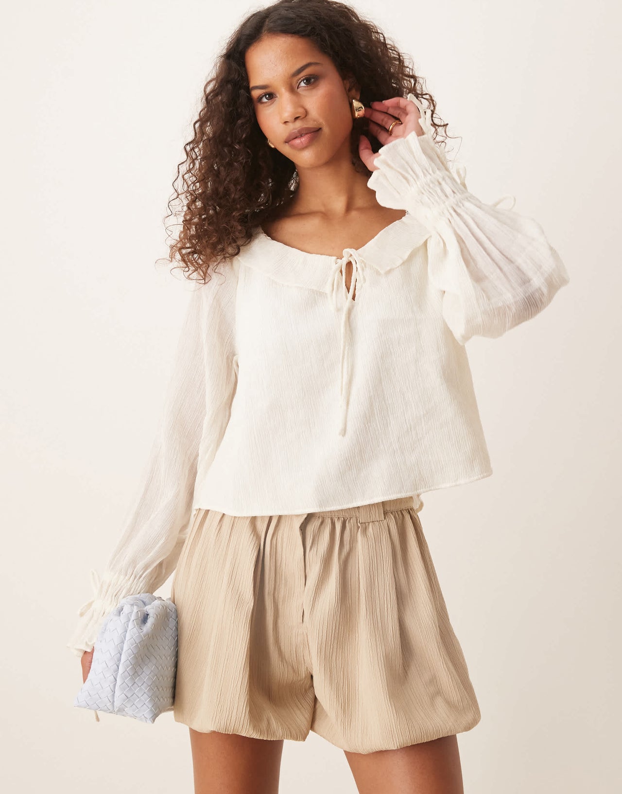 ASOS DESIGN tailored crinkle puffball hem shorts in stone