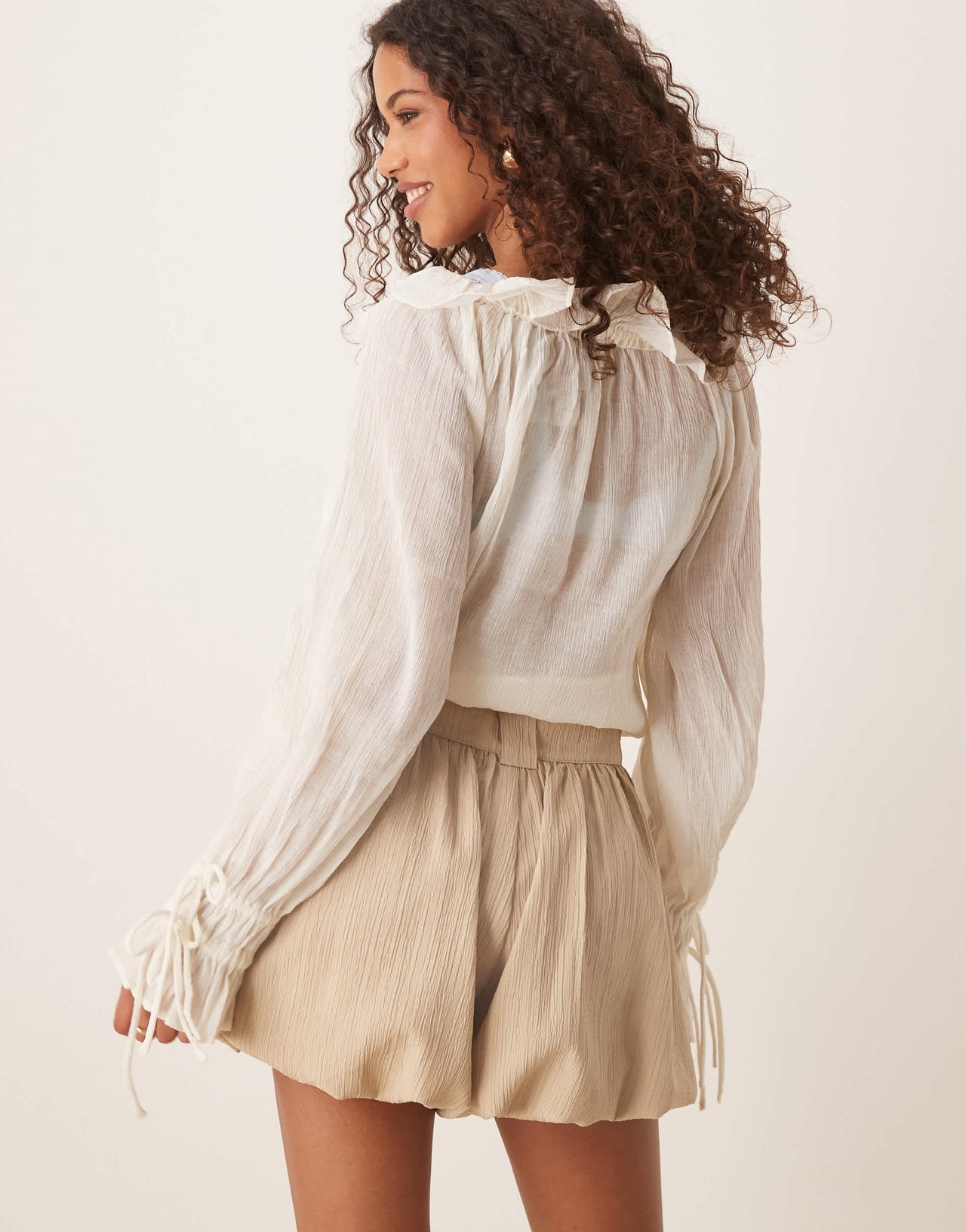 ASOS DESIGN tailored crinkle puffball hem shorts in stone