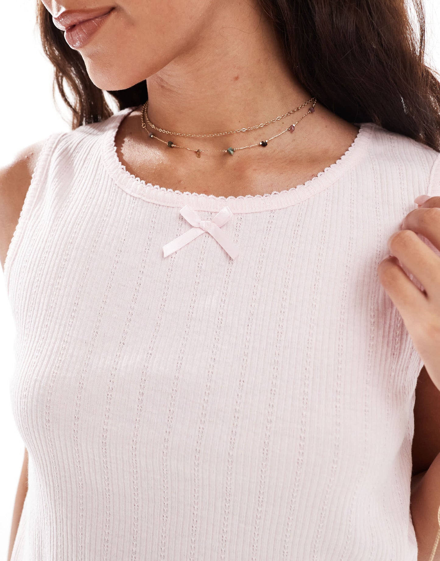 Pieces sleeveless cropped pointelle top with bow trim in pale pink