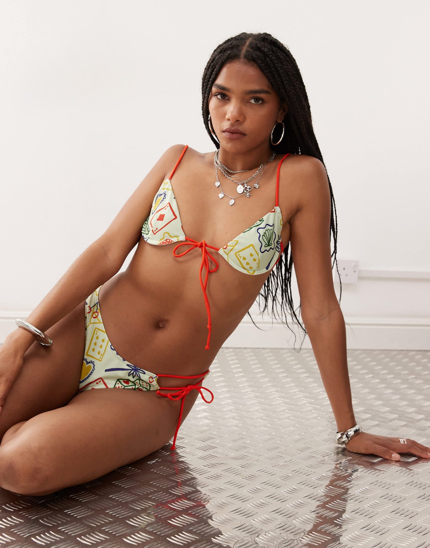 Reclaimed Vintage bikini top with skinny contrast straps in lucky holiday print