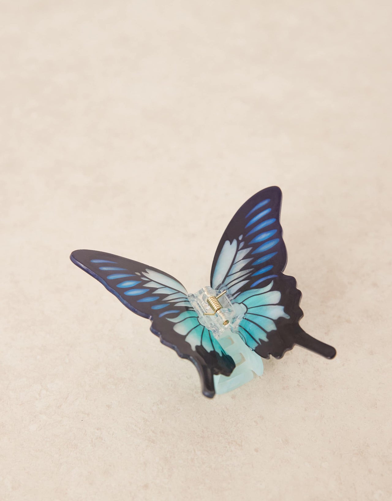 ASOS DESIGN butterfly hair claw in blue multi