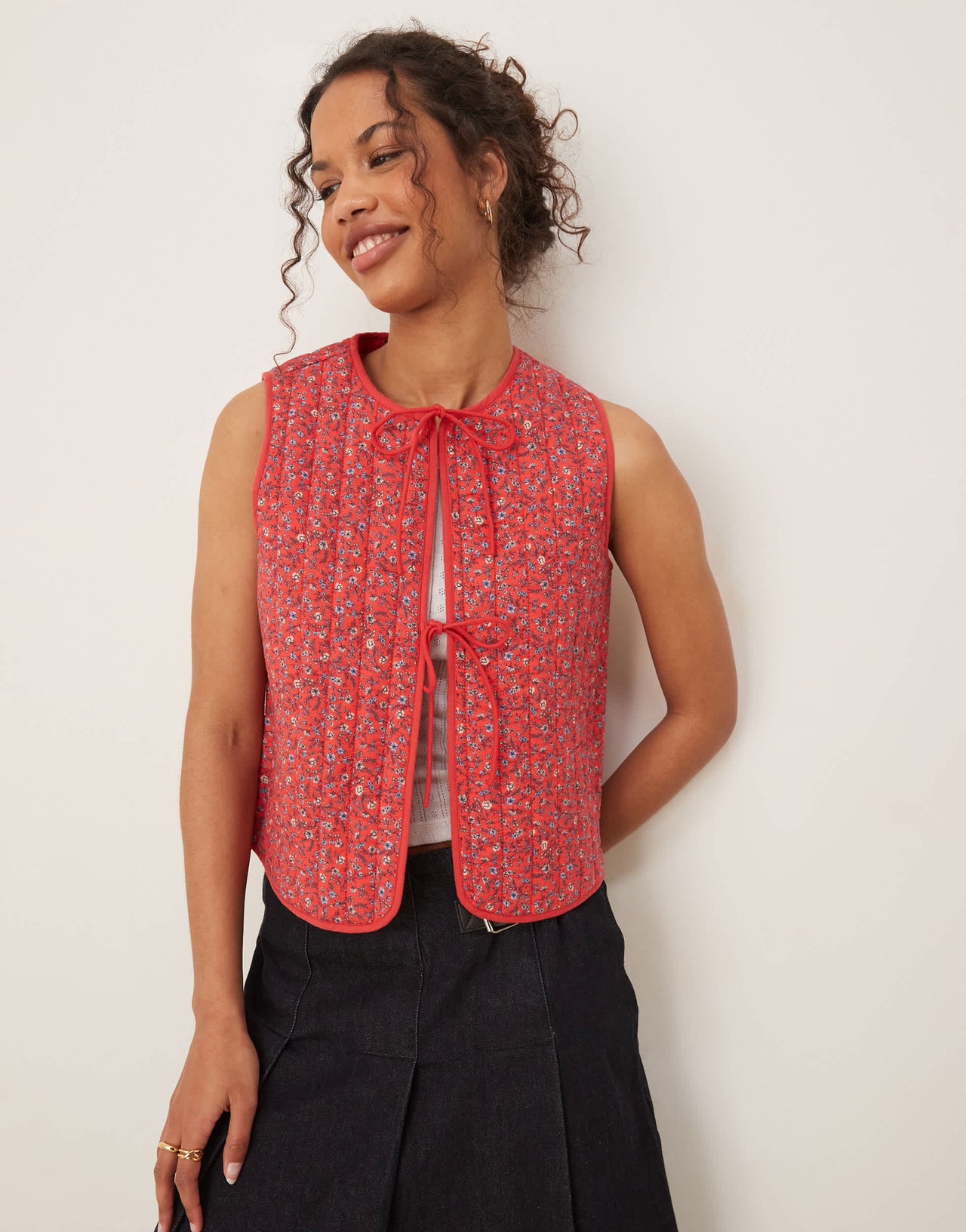 Nobody's Child tie-detail quilted gilet in red ditsy