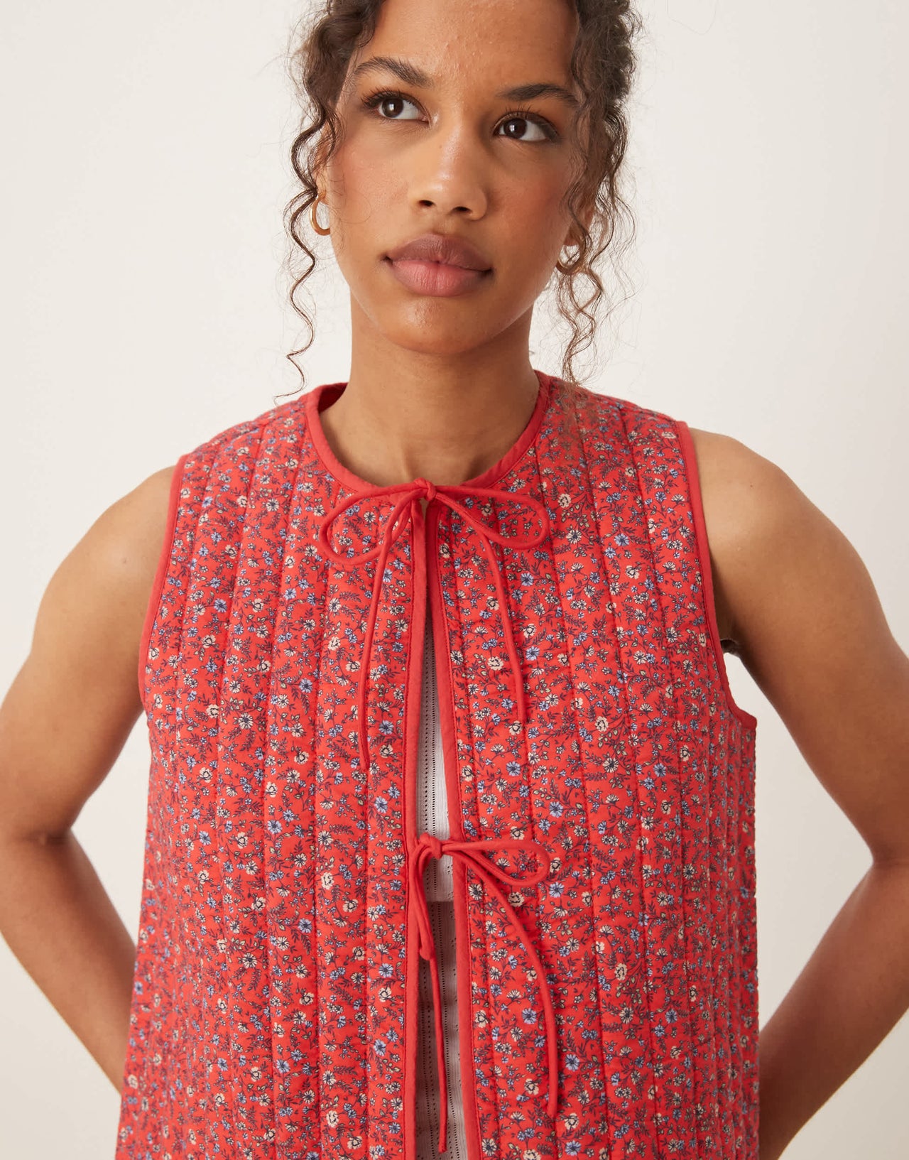 Nobody's Child tie-detail quilted gilet in red ditsy
