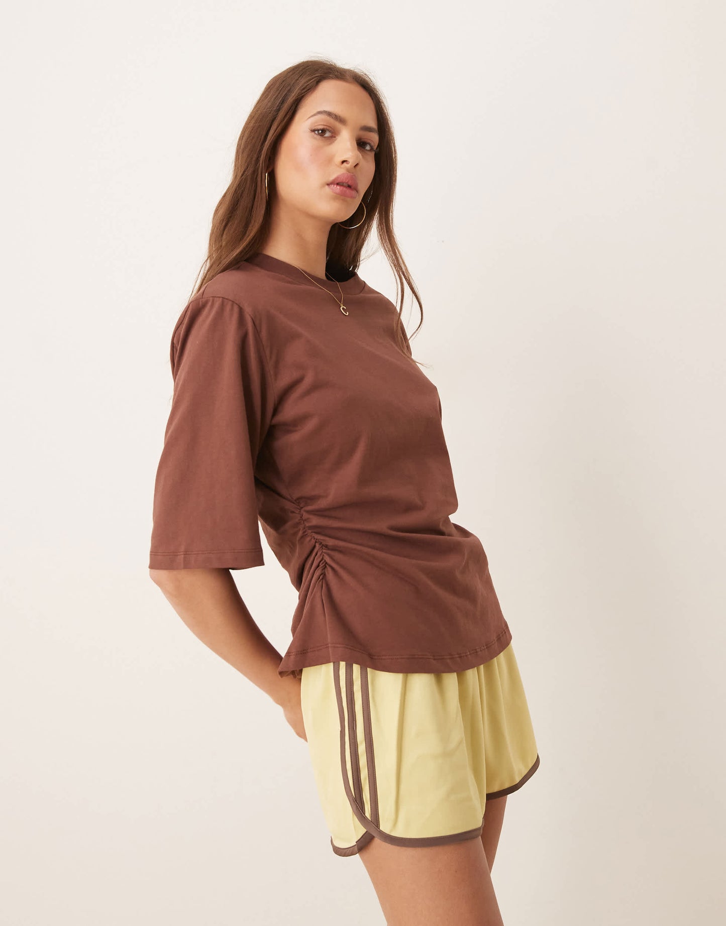 ASOS DESIGN cinched tee with shoulder pads in brown
