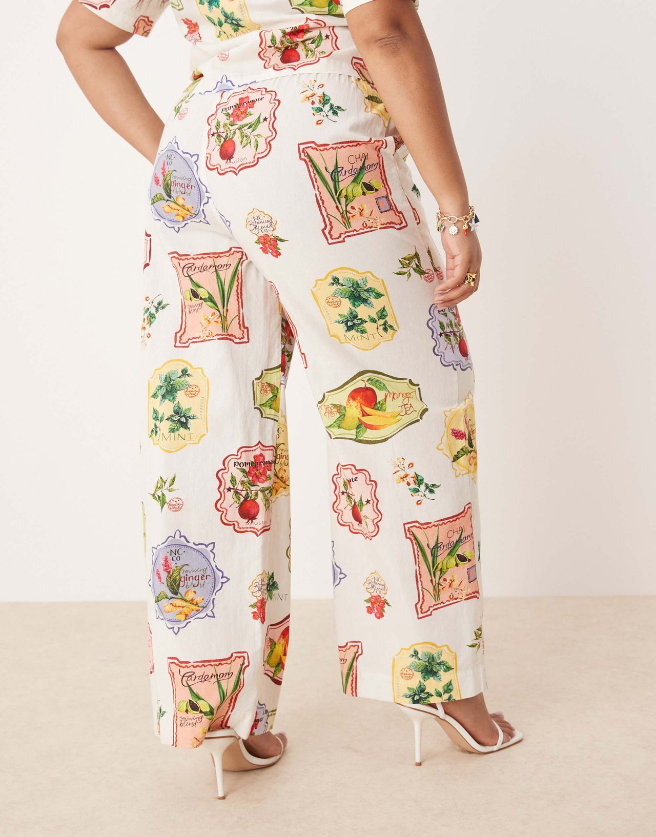 Nobody's Child Plus Shona straight leg trousers co-ord in postcard fruit print