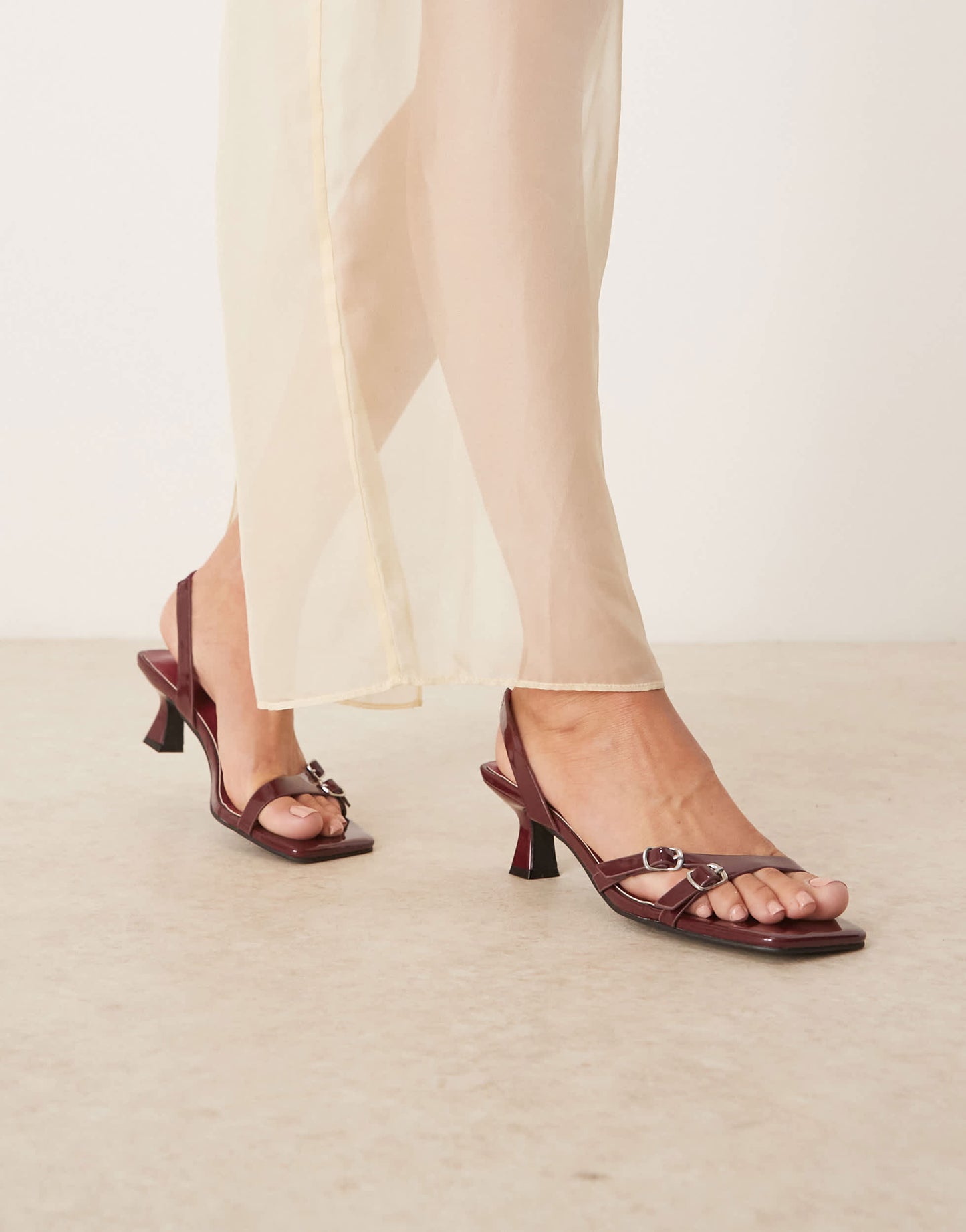 Glamorous heeled sandals with buckle detail in burgundy patent