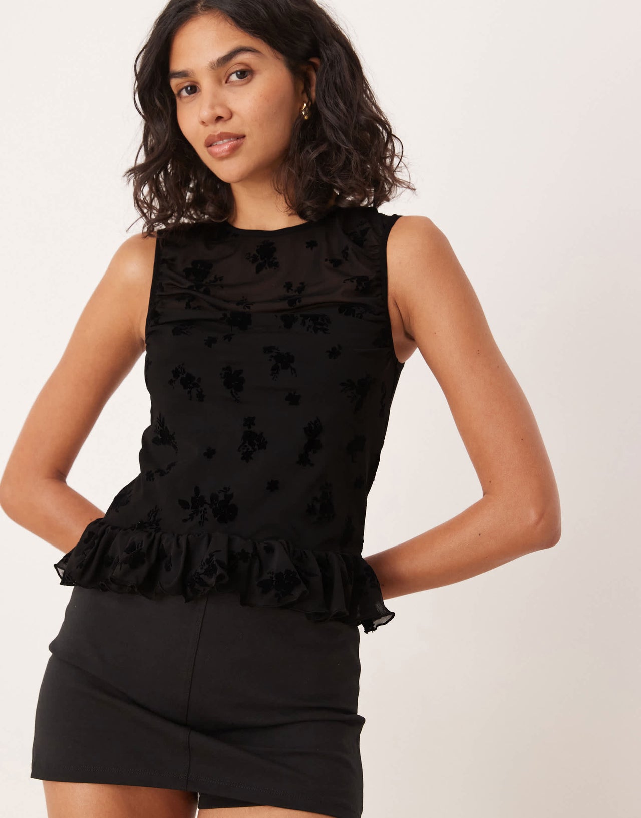 ASOS DESIGN flocked mesh ruched top with peplum hem in black - BLACK