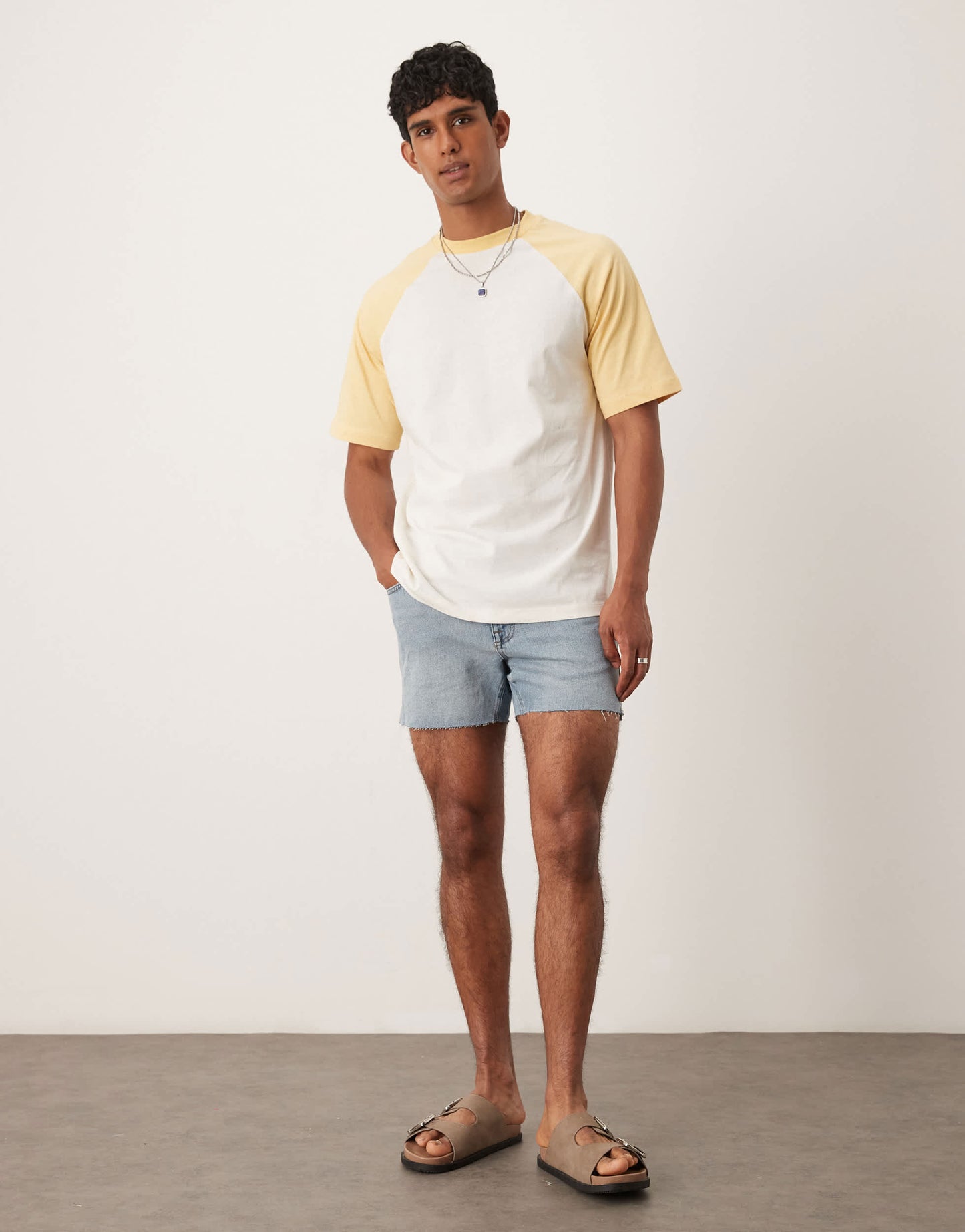 ASOS DESIGN shorter length slim denim shorts with rip detail in light wash blue