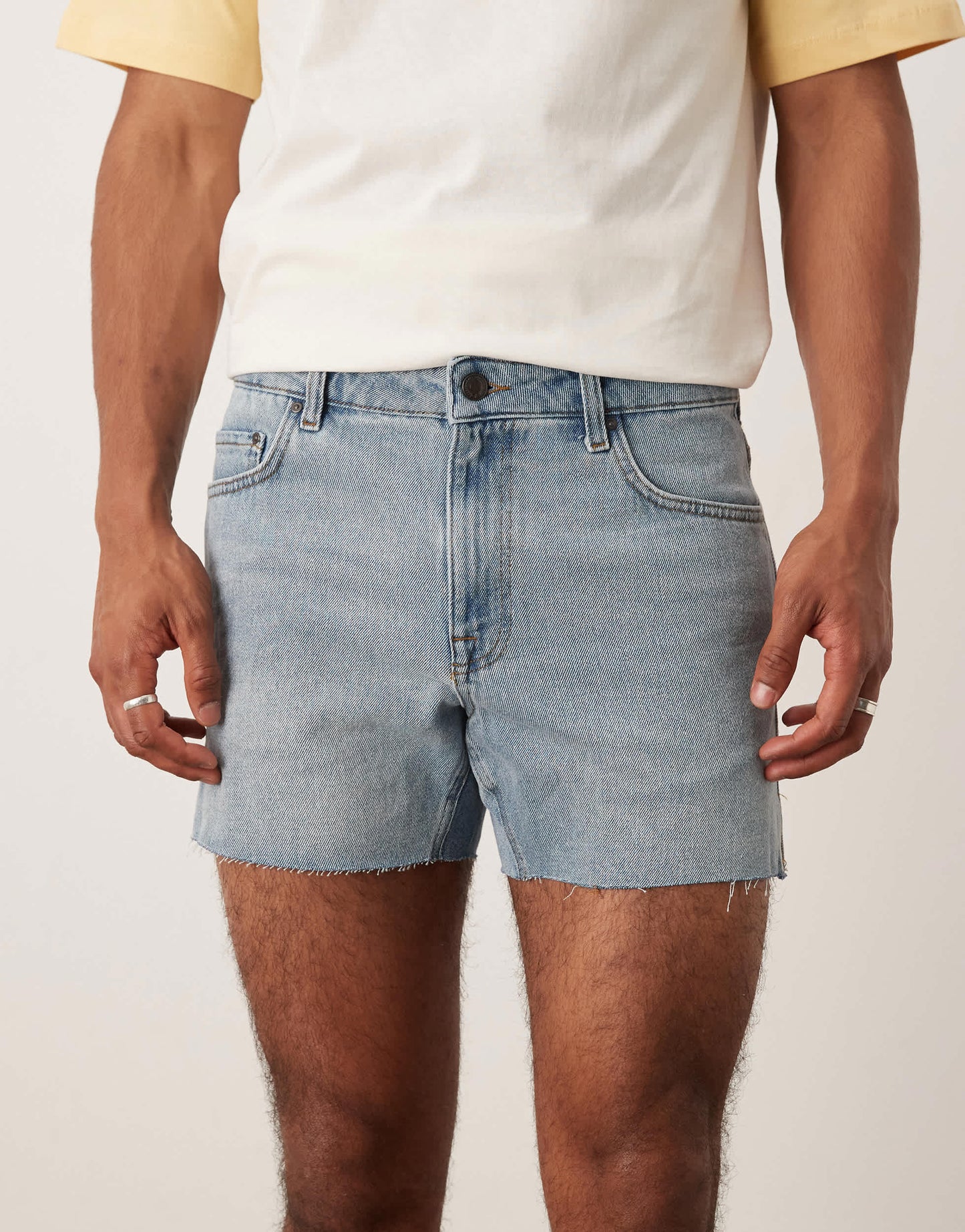 ASOS DESIGN shorter length slim denim shorts with rip detail in light wash blue