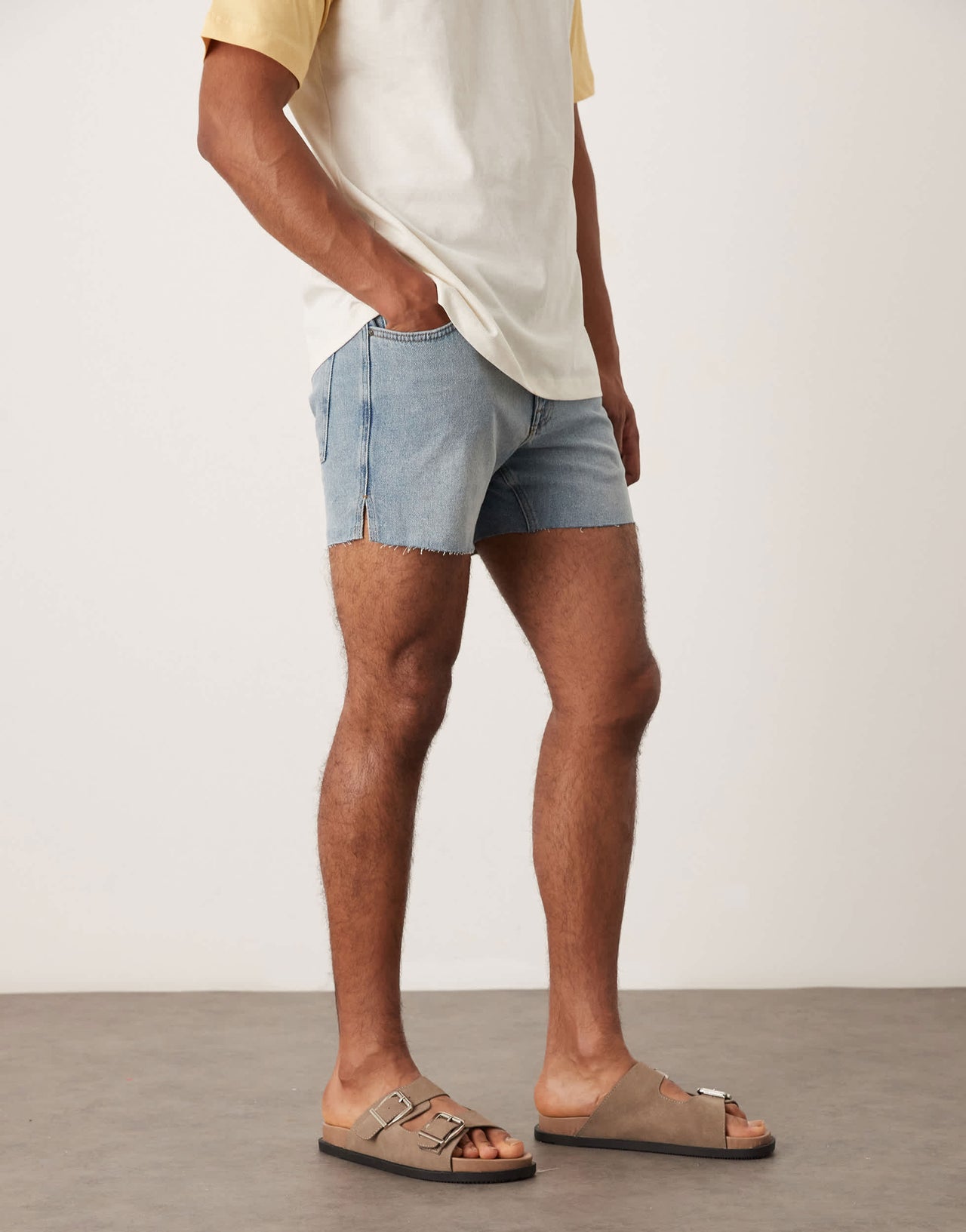 ASOS DESIGN shorter length slim denim shorts with rip detail in light wash blue