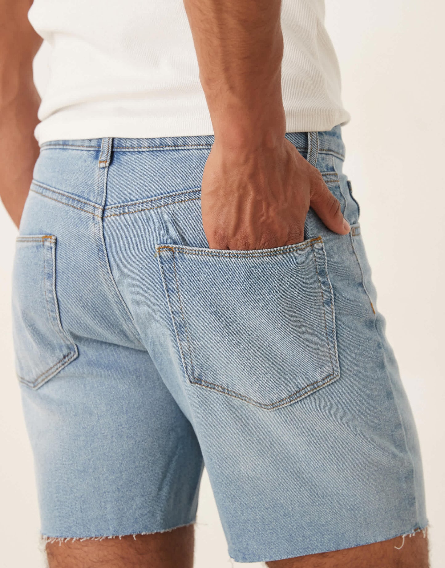 ASOS DESIGN mid length slim denim shorts in light wash blue