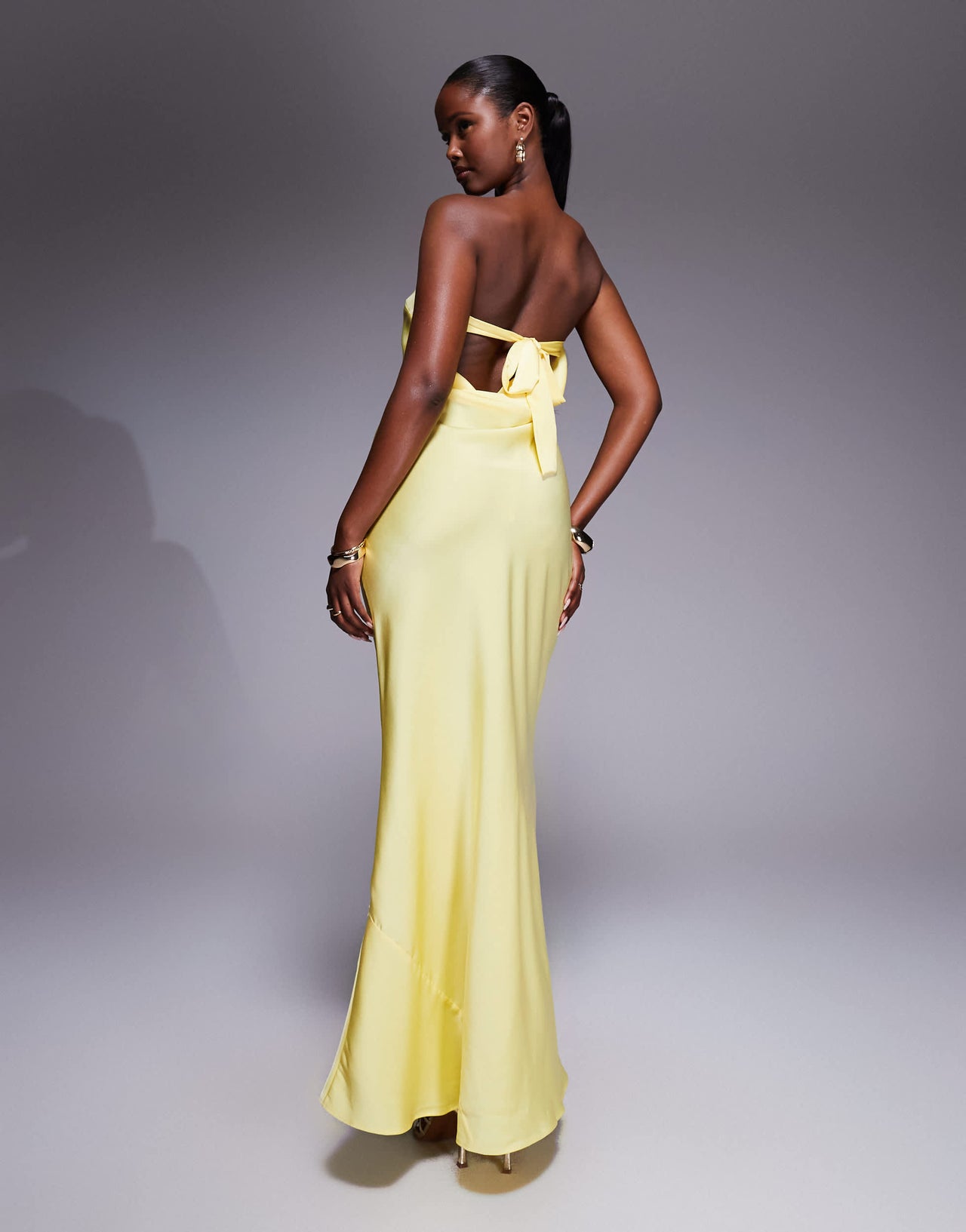 ASOS DESIGN satin trapeze bandeau maxi dress with bow back detail in buttermilk