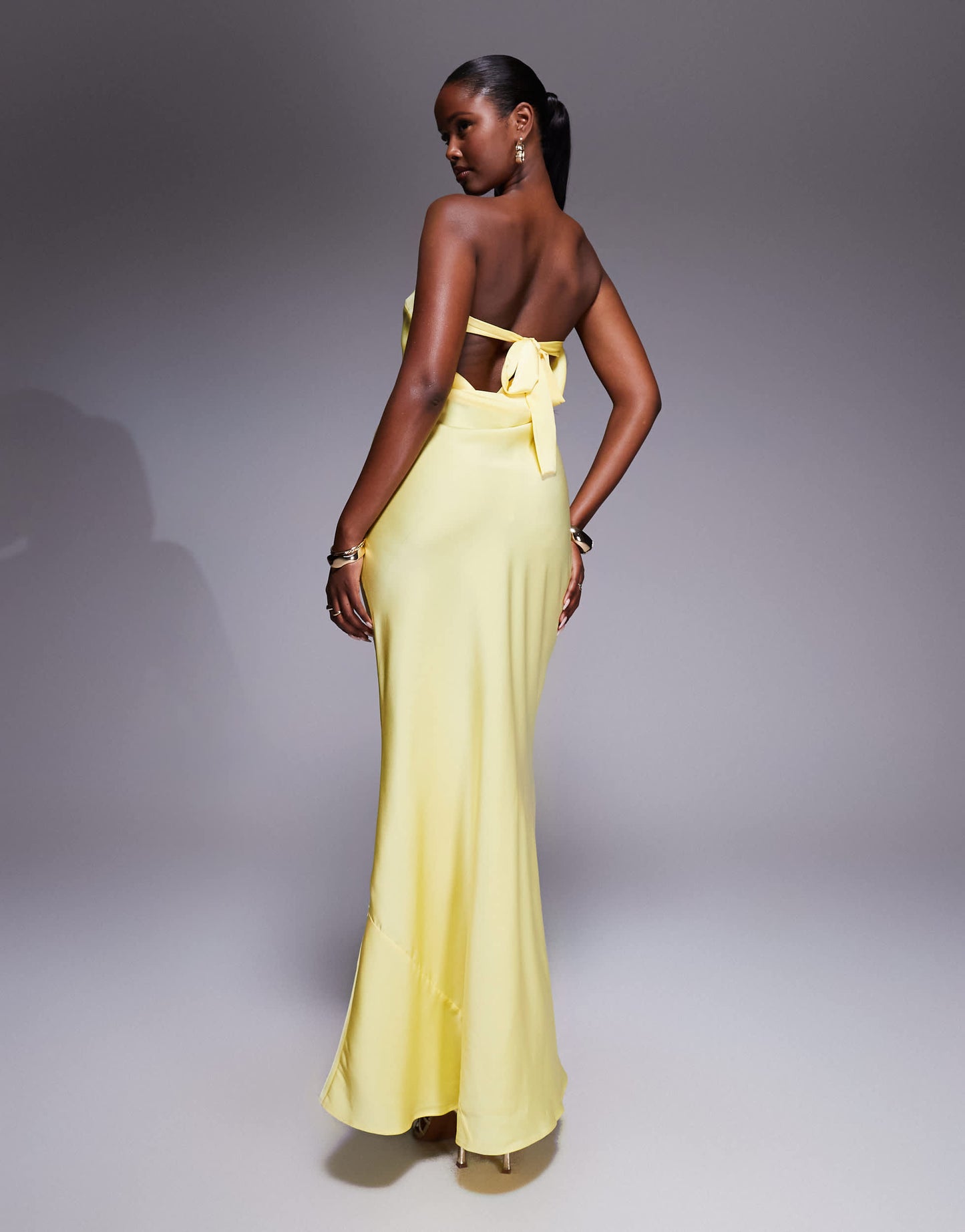 ASOS DESIGN satin trapeze bandeau maxi dress with bow back detail in buttermilk