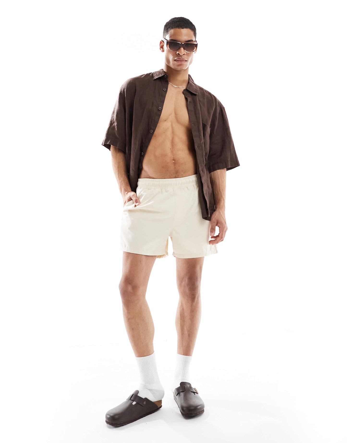 ASOS DESIGN swim shorts in short length in beige