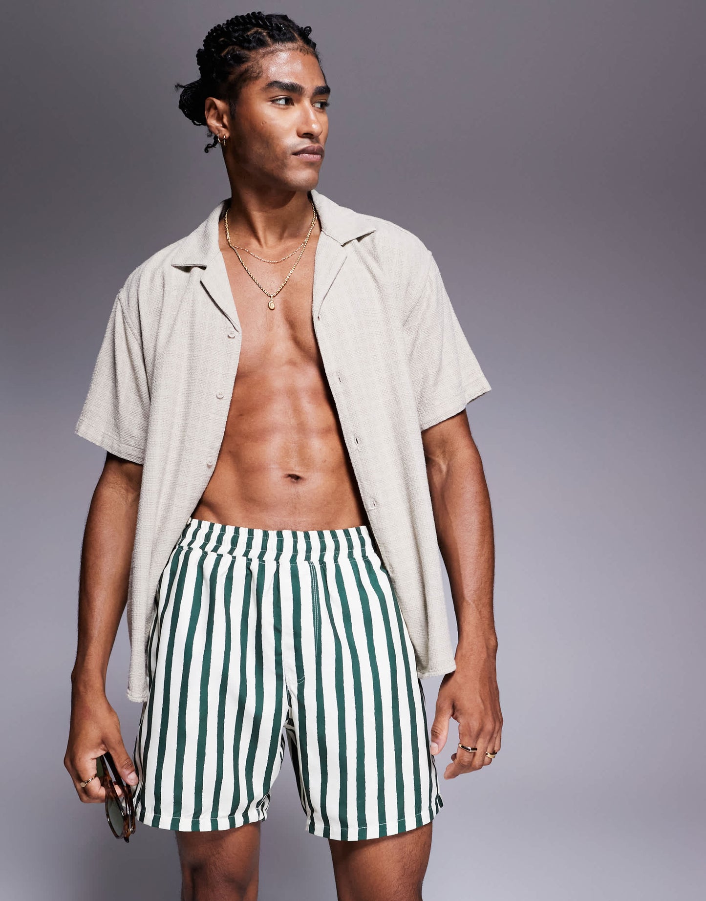 ASOS DESIGN swim shorts in mid length in green stripe