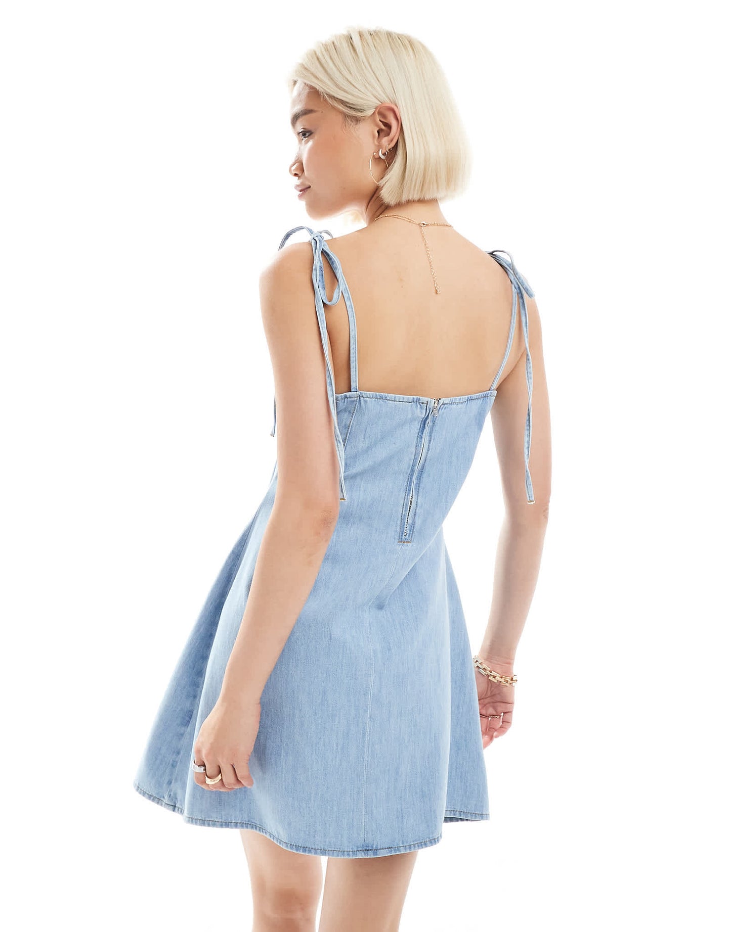 ASOS DESIGN tie shoulder denim mini dress with pleats in mid blue