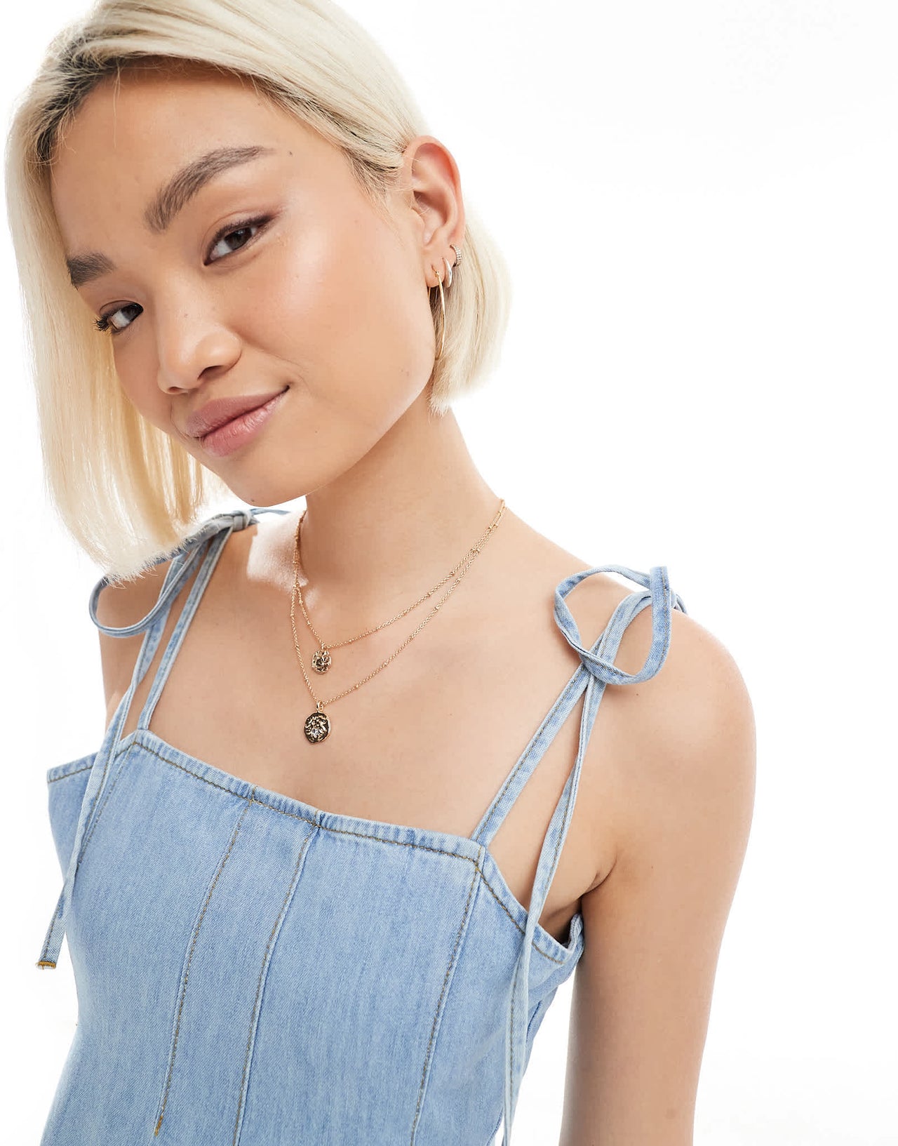 ASOS DESIGN tie shoulder denim mini dress with pleats in mid blue