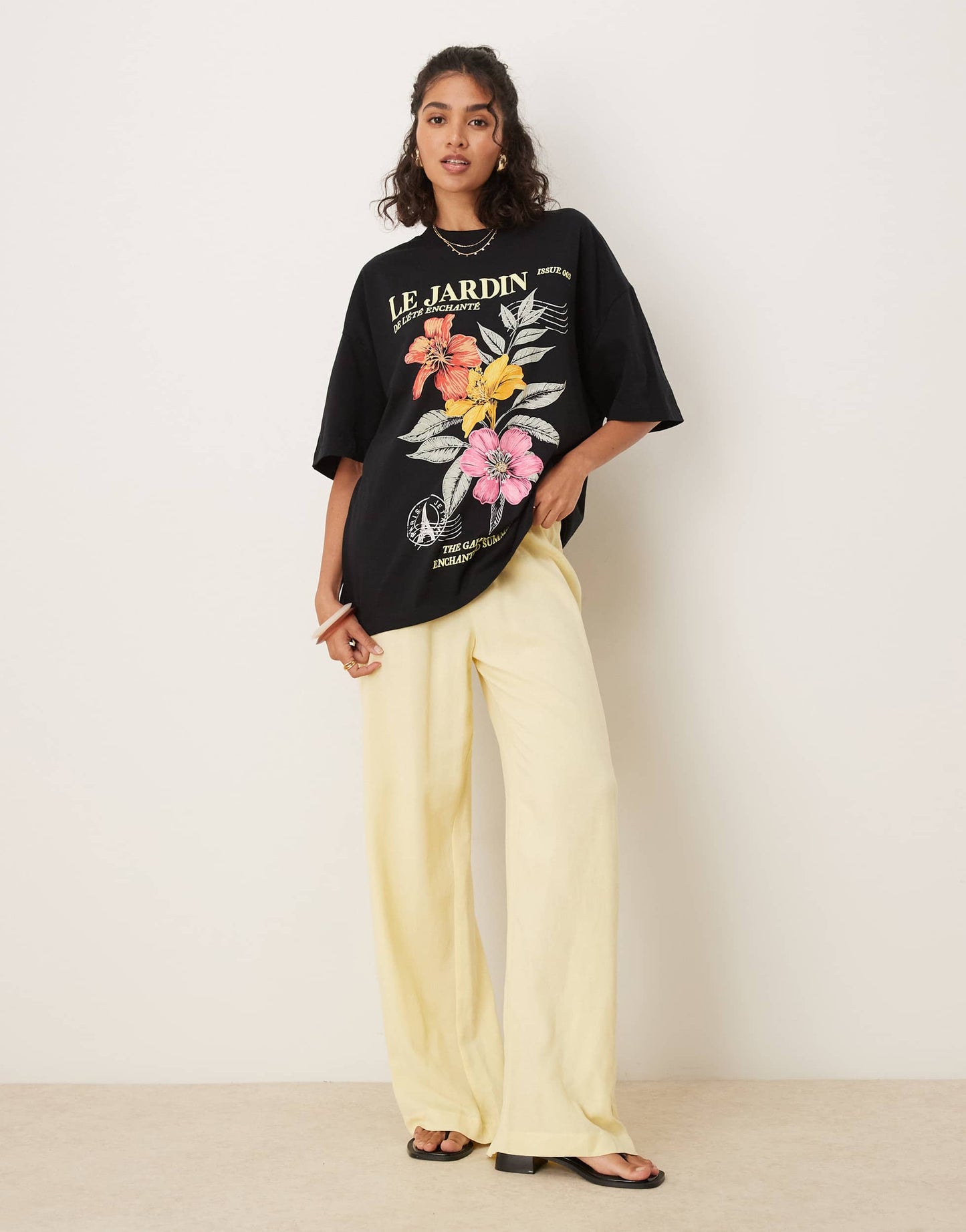 ASOS DESIGN oversized t-shirt with le jardin floral graphic in black