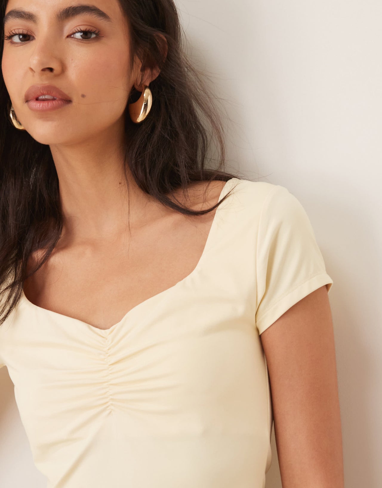 ASOS DESIGN slinky short sleeve top with ruched bust in buttermilk