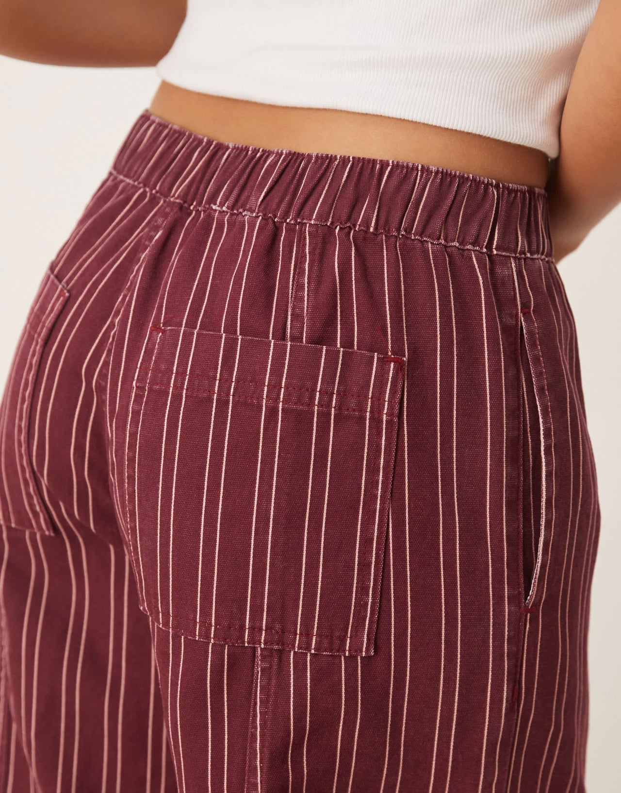 ASOS DESIGN laundered pull on barrel trousers in burgundy stripe