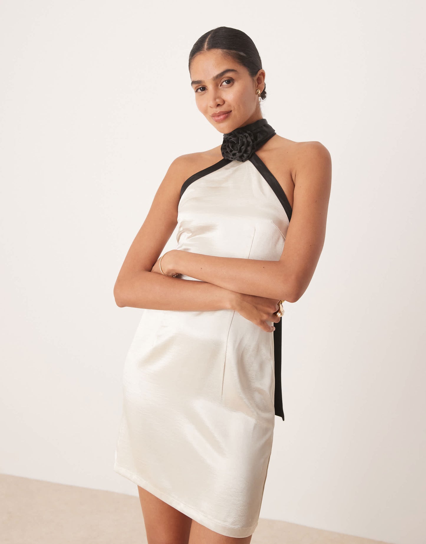 Amy Lynn contrast halter neck satin mini dress in soft gold and black