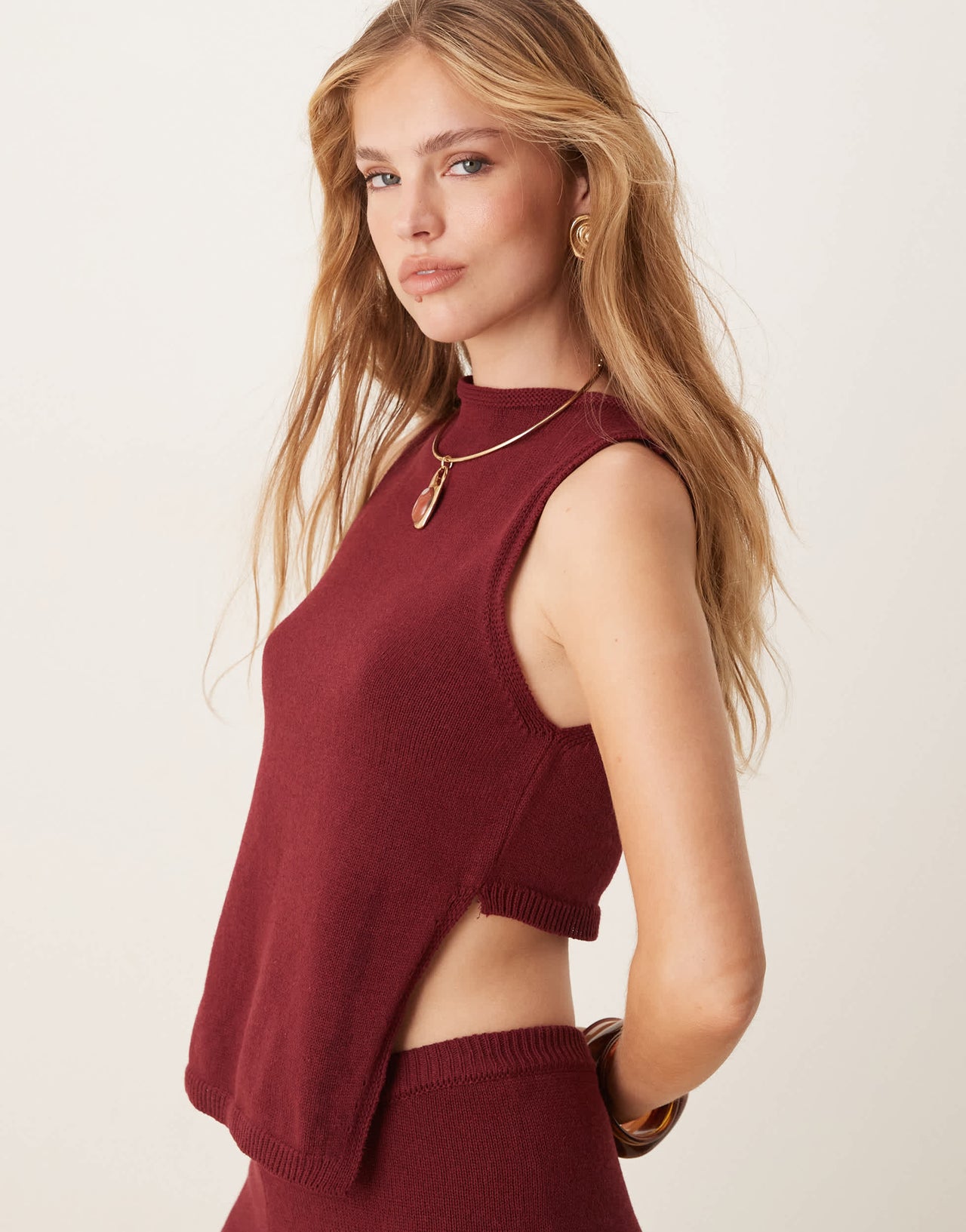 ASOS DESIGN knitted racer top with angled front panel in burgundy
