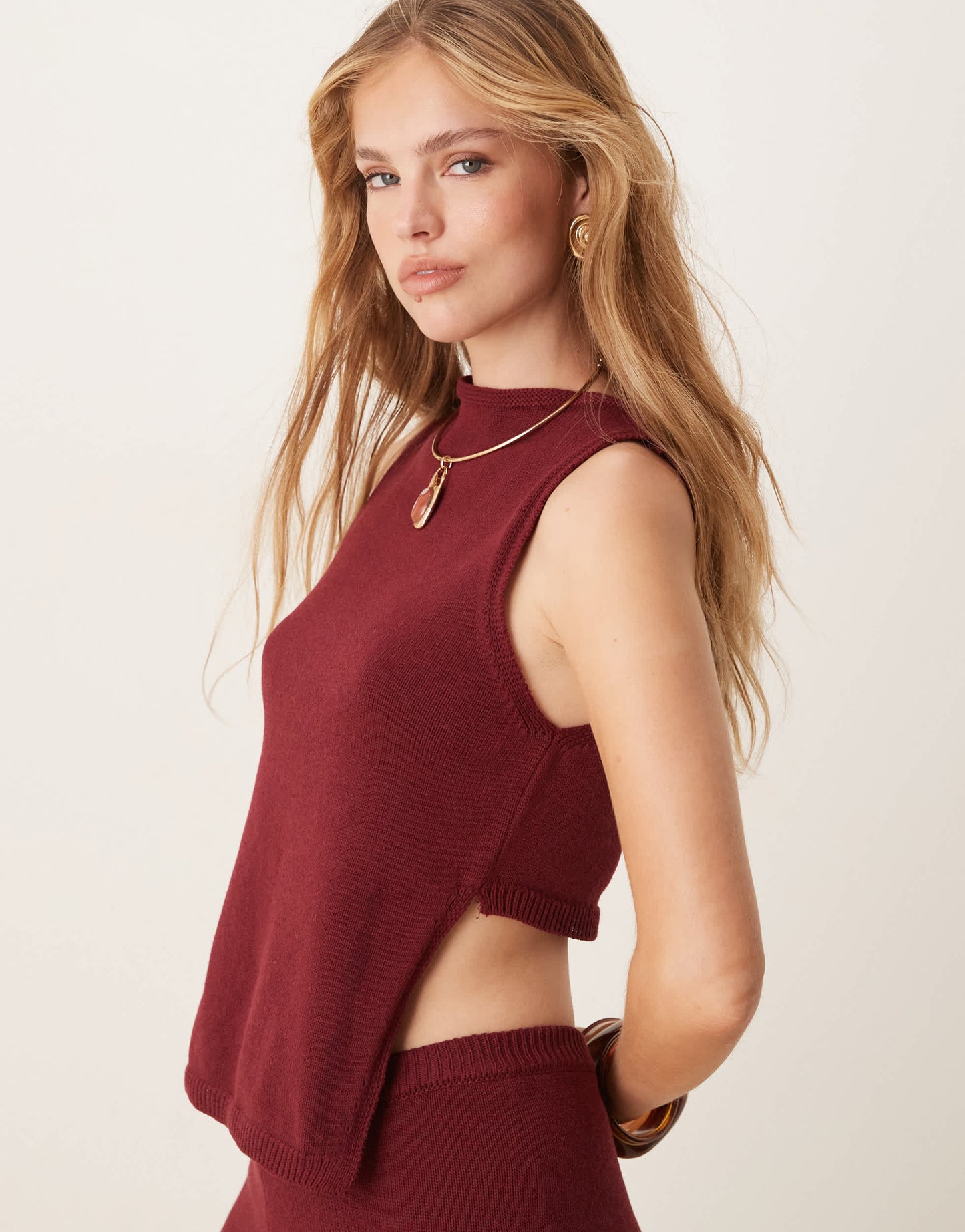 ASOS DESIGN knitted racer top with angled front panel in burgundy