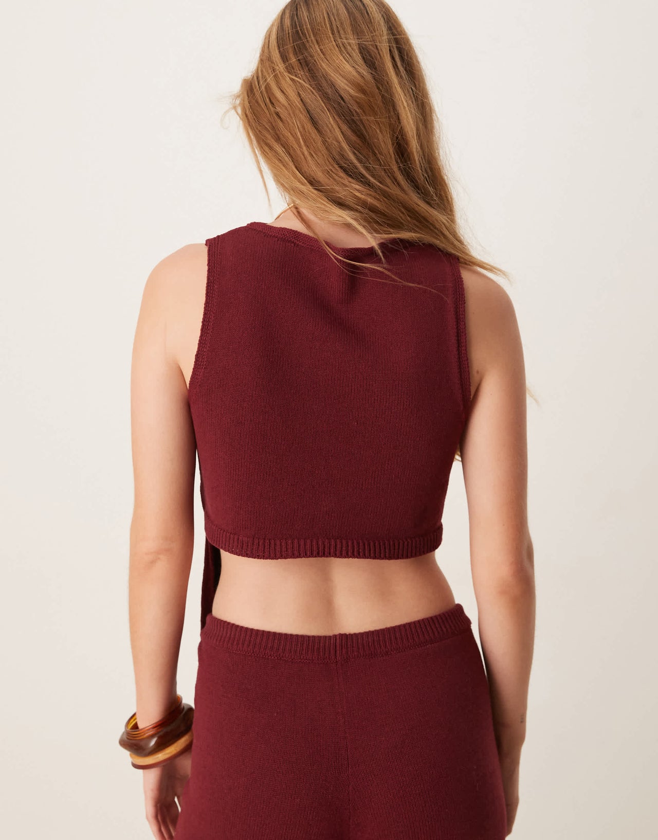 ASOS DESIGN knitted racer top with angled front panel in burgundy