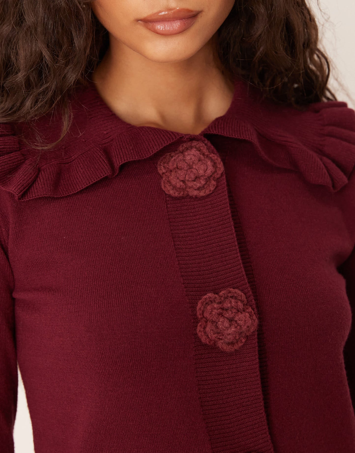Glamorous rose applique cardigan with dramatic collar in burgundy