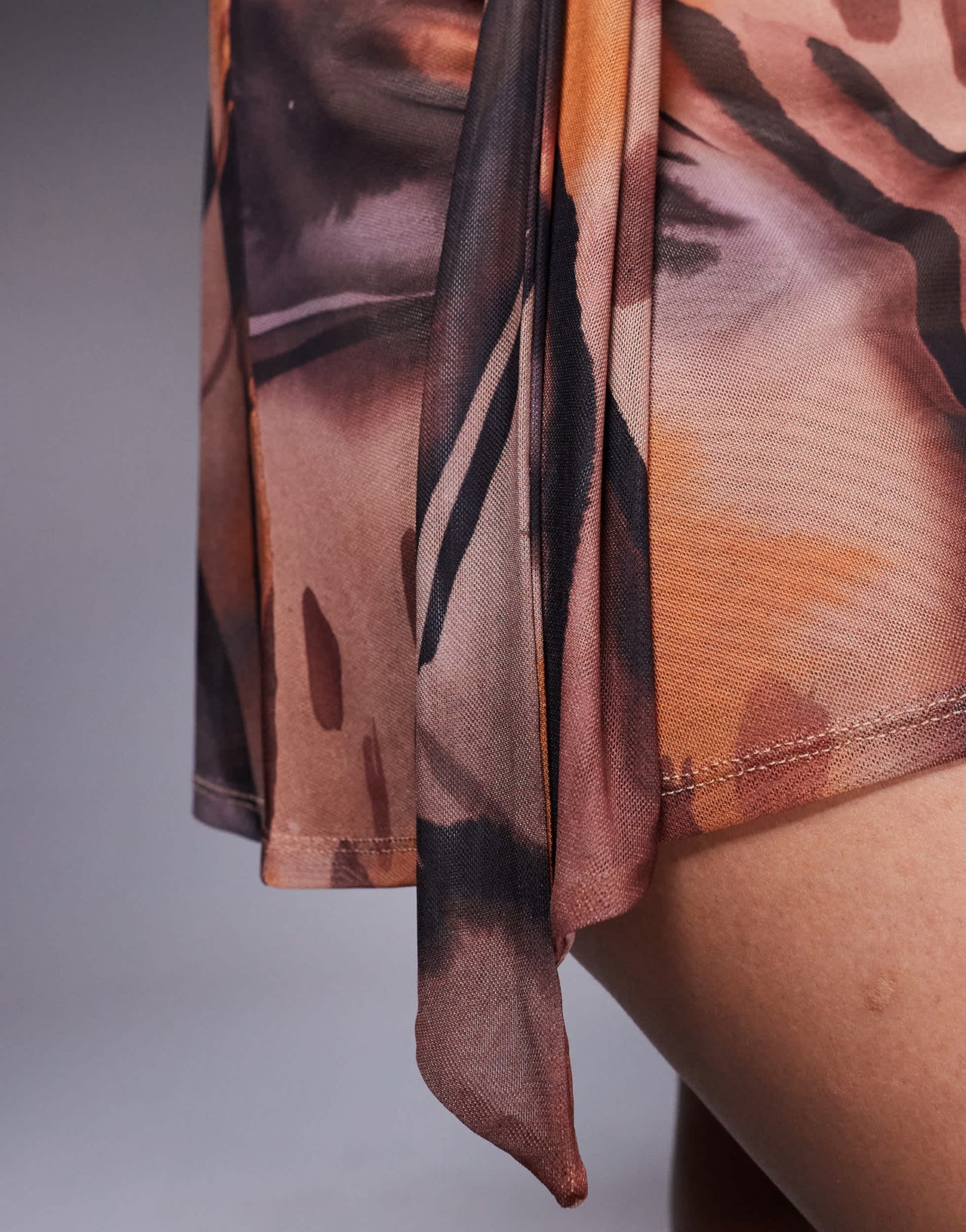 ASOS DESIGN co-ord mesh flippy mini skirt with ruched tie detail in brown abstract print