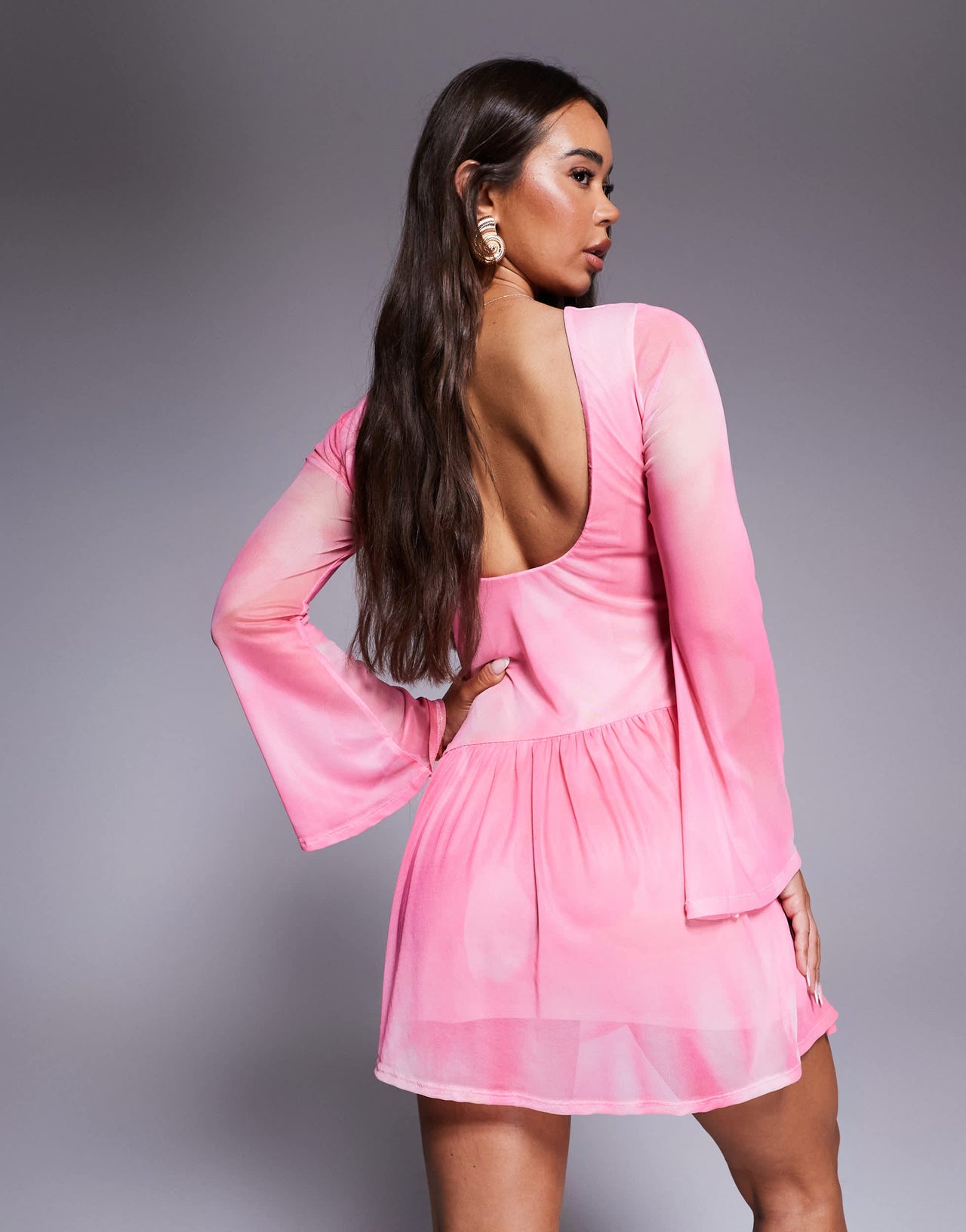 ASOS DESIGN mini dress with shaped hem detail and flippy skirt in pink print