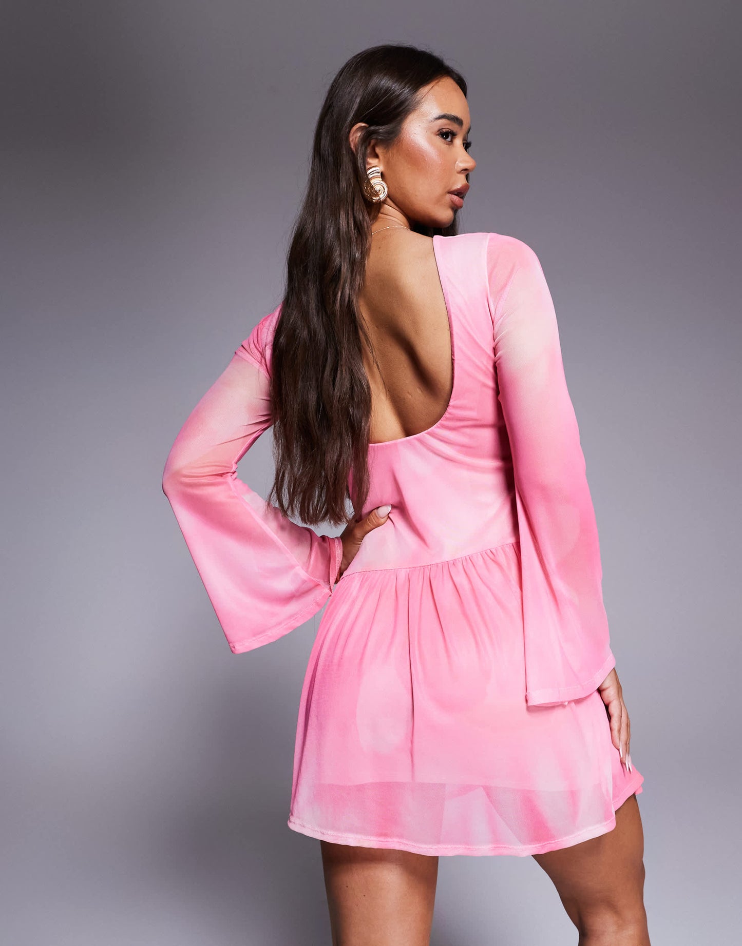 ASOS DESIGN mini dress with shaped hem detail and flippy skirt in pink print