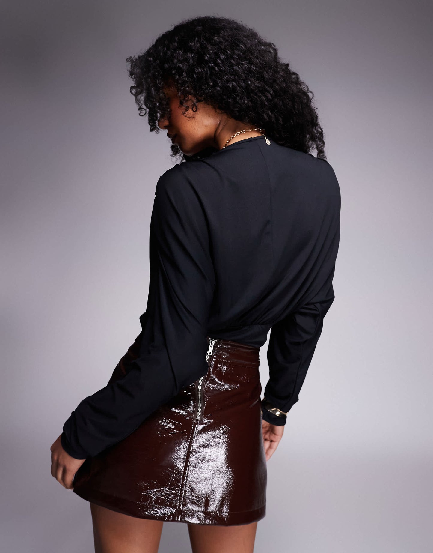 ASOS DESIGN wrap front plunge batwing top with shoulder pad detail in black