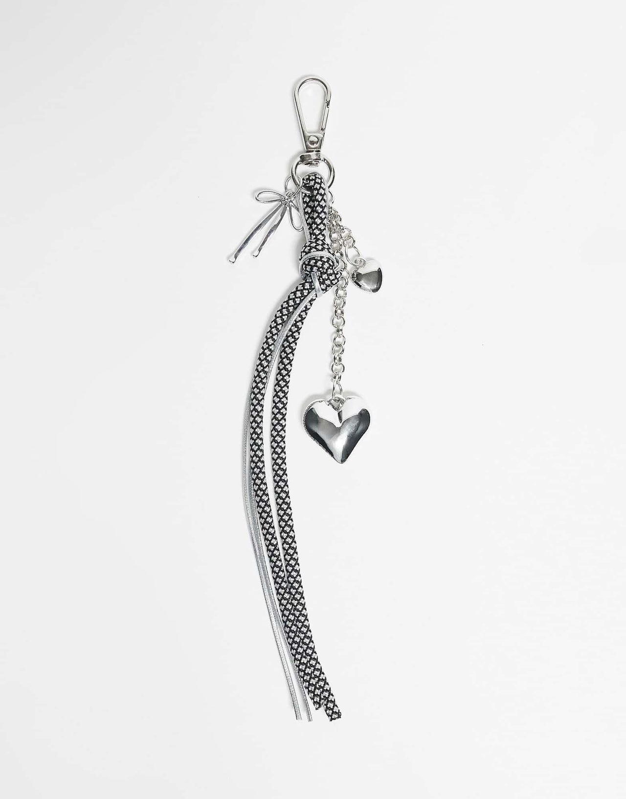 DesignB London bungee cord and heart bag charm in black and white polka dot