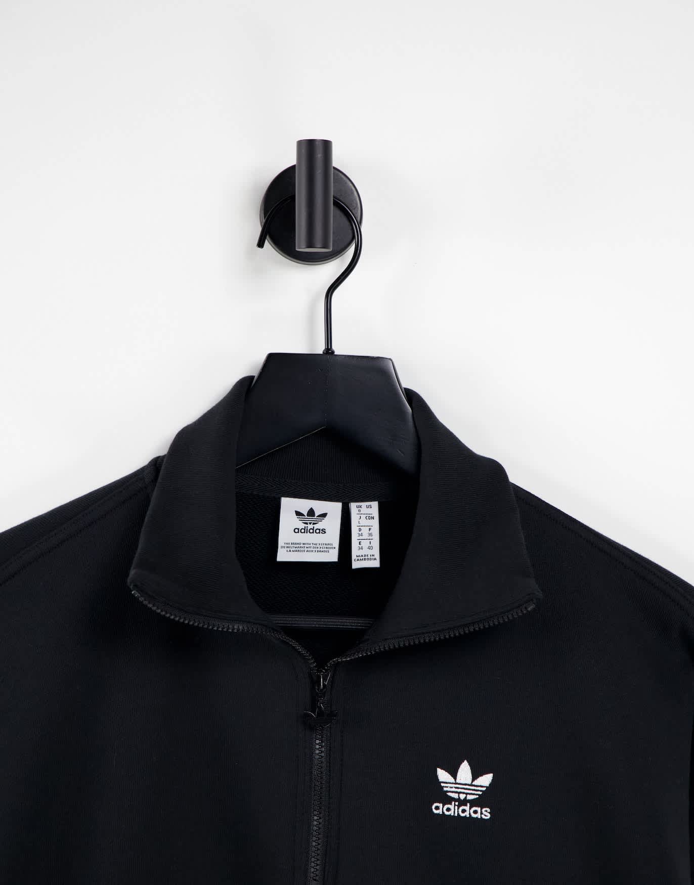 adidas Originals adicolor three stripe quarter zip sweatshirt in black
